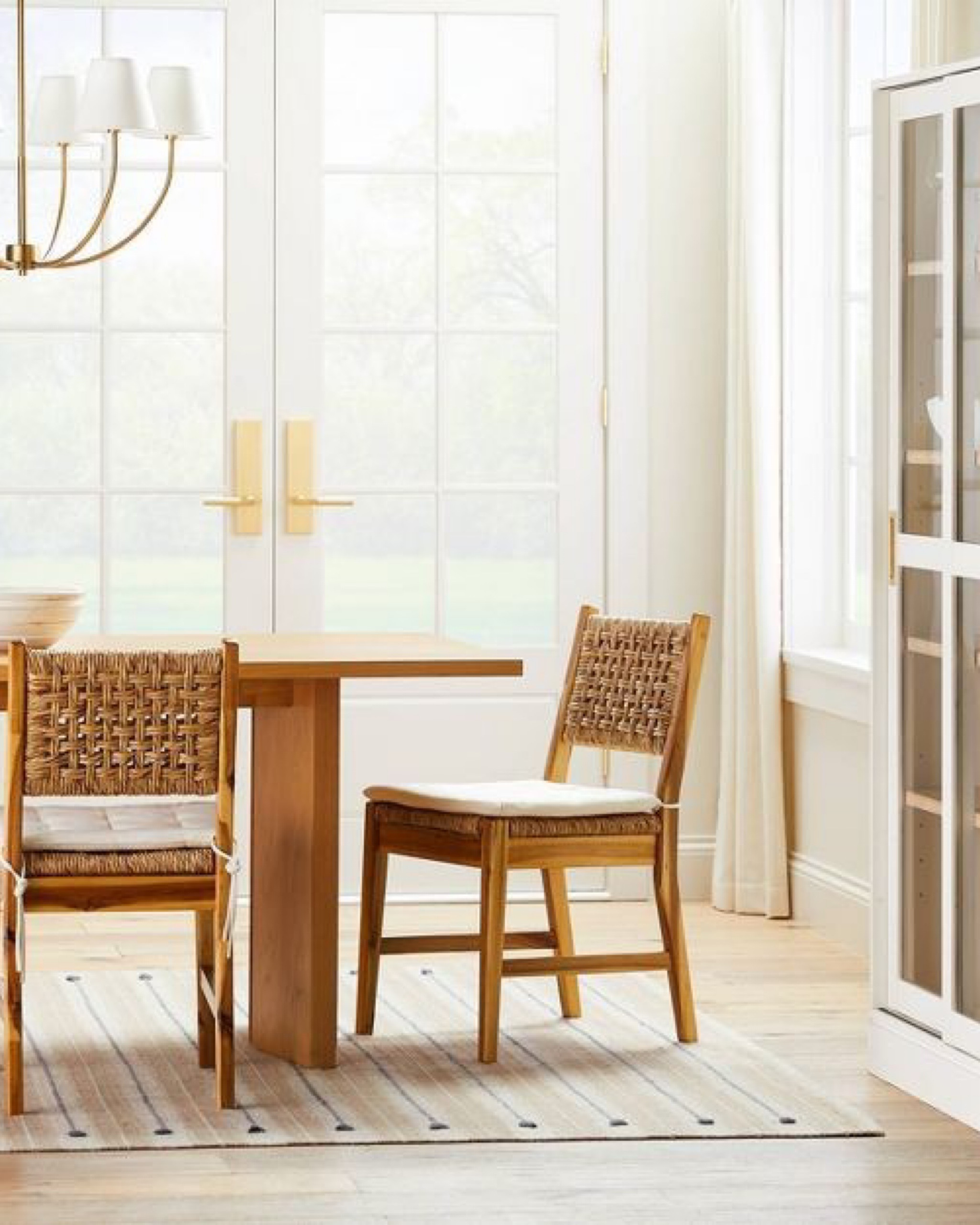 New studio mcgee wood and woven dining chairs. Gorgeous chandelier and rug. So beautiful! 

#LTKhome #LTKfamily #LTKSeasonal