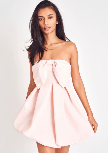 Bow bliss Kerrigan Dress is the perfect pink bridal shower dress for brides looking for fun and pretty look! It’s the perfect wedding shower dress for brides that are the life of every party, this epic, strapless mini stuns in a silky, moire fabric embossed with an oversized romantic bow at center front that sits above a playful, 80’s-inspired bubble skirt. The skirt features a mesh beneath for support. Grab it now brides-to-be! #bridalshowerdress #whitedress #pinkdress #bridetobe #weddingshower #planawedding #pinkshowerdress #bridetobe #2023wedding #instabride #pinkdress #pinkminidress {these are affiliate links and I make commissions from purchases)! 

#LTKstyletip #LTKwedding #LTKFind