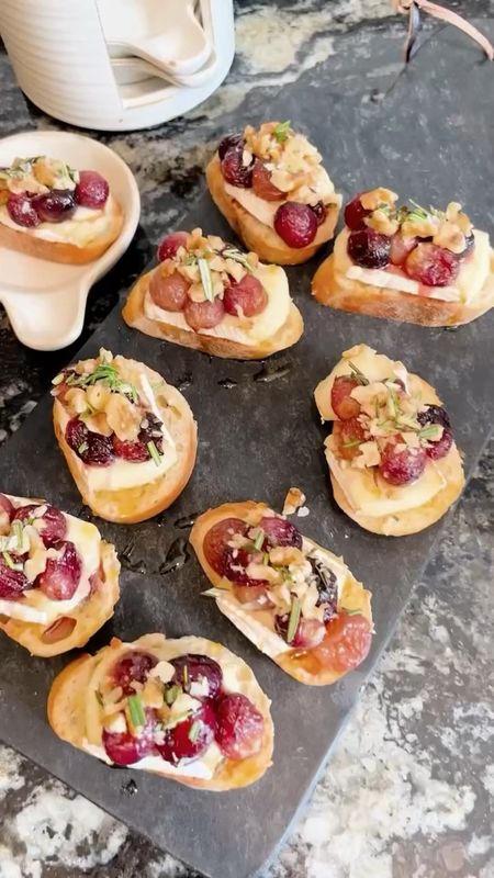 Pulled out our marble serving board and tapas plates (both included in the Warehouse Sale) for this roasted grape & brie crostini with honey + sea salt – a simple appetizer that will blow you away 🥖🍇🧀 So yummy and so fun for parties! Save this post and let us know if you try it.

INGREDIENTS
• 4 cups red grapes
• 2 tablespoons olive oil
• French baguette
• 8 ounces brie cheese
• Honey
• Maldon sea salt
• ¼ cup chopped toasted walnuts
• 1 teaspoon fresh rosemary

DIRECTIONS
• Toss grapes with 1 tablespoon olive oil and sprinkle with sea salt. Roast at 400 degrees F for 15 minutes. Set aside to cool.
• Place baguette slices on a baking sheet and brush with the remaining 1 tablespoon olive oil. Top with slices of brie and bake 5-7 minutes or until cheese is melted.
• Spoon grapes on top of cheese and drizzle honey all over. Sprinkle with walnuts and sea salt, and garnish with rosemary.

Recipe via @ambitiouskitchen

#LTKSeasonal #LTKparties #LTKhome