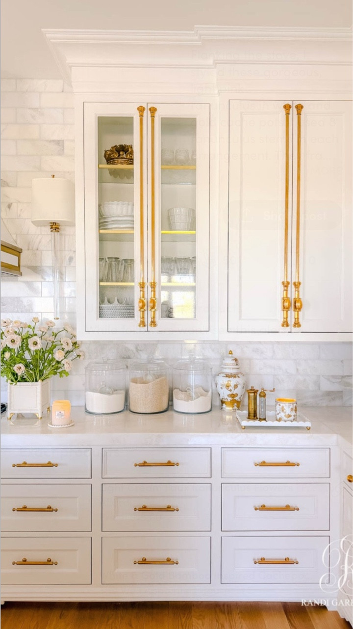 Flanking the stove, I styled these gorgeous, light pink ranunculus in white and gold cache pots. I used 8 ranunculus stems in each arrangement. They frame the range and add some charm and whimsy to the room.

Scent is such an important part of styling for me. These Ginori 1735 candles add a soft, refined aroma throughout the kitchen, while Coconut Papaya candles bring the most beautiful tropical sweetness that coordinates perfectly with the peachy pink florals.

There are charming scalloped details throughout the kithchen— on the candle trays, scalloped vignette tray, and even the soap tray  Those soft curves feel feminine and playful, balancing the more structured elements in the kitchen.

#LTKSeasonal #LTKHome