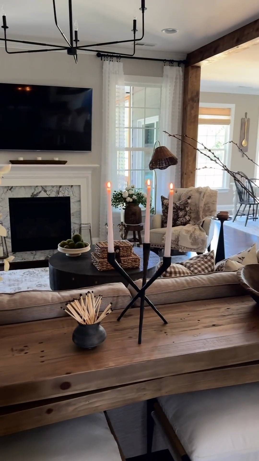 This candelabra really is that good!! I was obsessed the minute I saw it. It makes quite the statement in my spring living room🥰

Black candelabra, console table, ottomans, vintage wood bowl, glass cylinder, pussy Willow stems, pillow covers, pillow inserts, round coffee table, woven storage boxes, neutral area rug, vase, spring stems, vintage clay pot, matches, chandelier

#LTKHome #LTKSeasonal #LTKstorytime