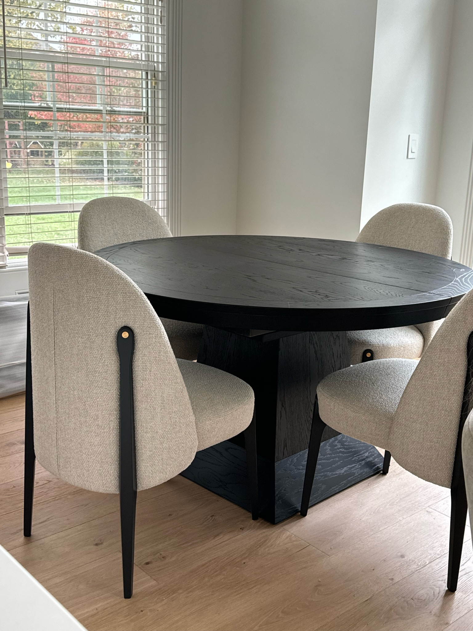 Dining room refresh with a more modern round dining table and chairs. Black and neutrals aesthetic with gold accents

#LTKhome