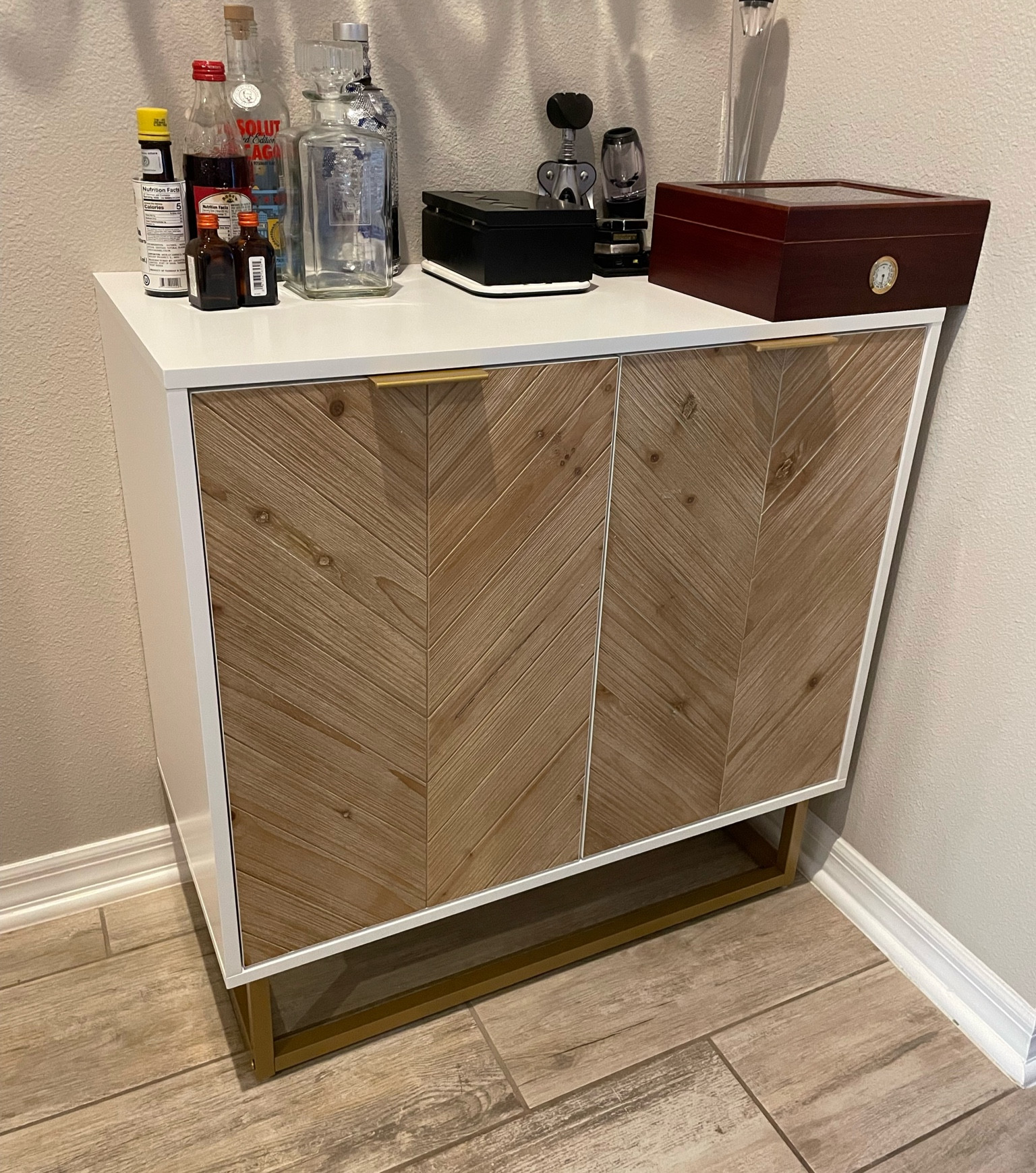 Stylish bar cabinet perfect addition to any bar area. Has ample storage on the inside. Amazon find. Such good quality. It does come in pieces but assembly was pretty easy. It took about 30-45 minutes to put together  

#LTKGiftGuide #LTKhome #LTKstyletip