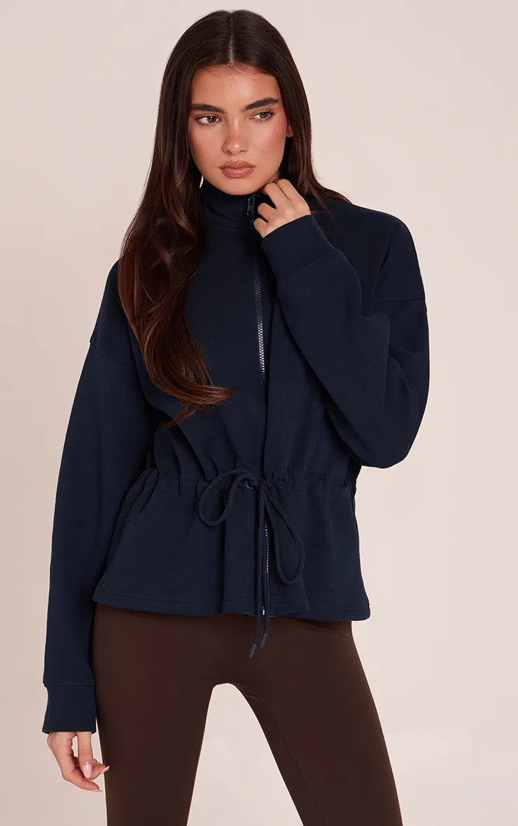 Navy Interlock Peplum Funnel Neck Zip Up Jacket | PrettyLittleThing | PrettyLittleThing UK