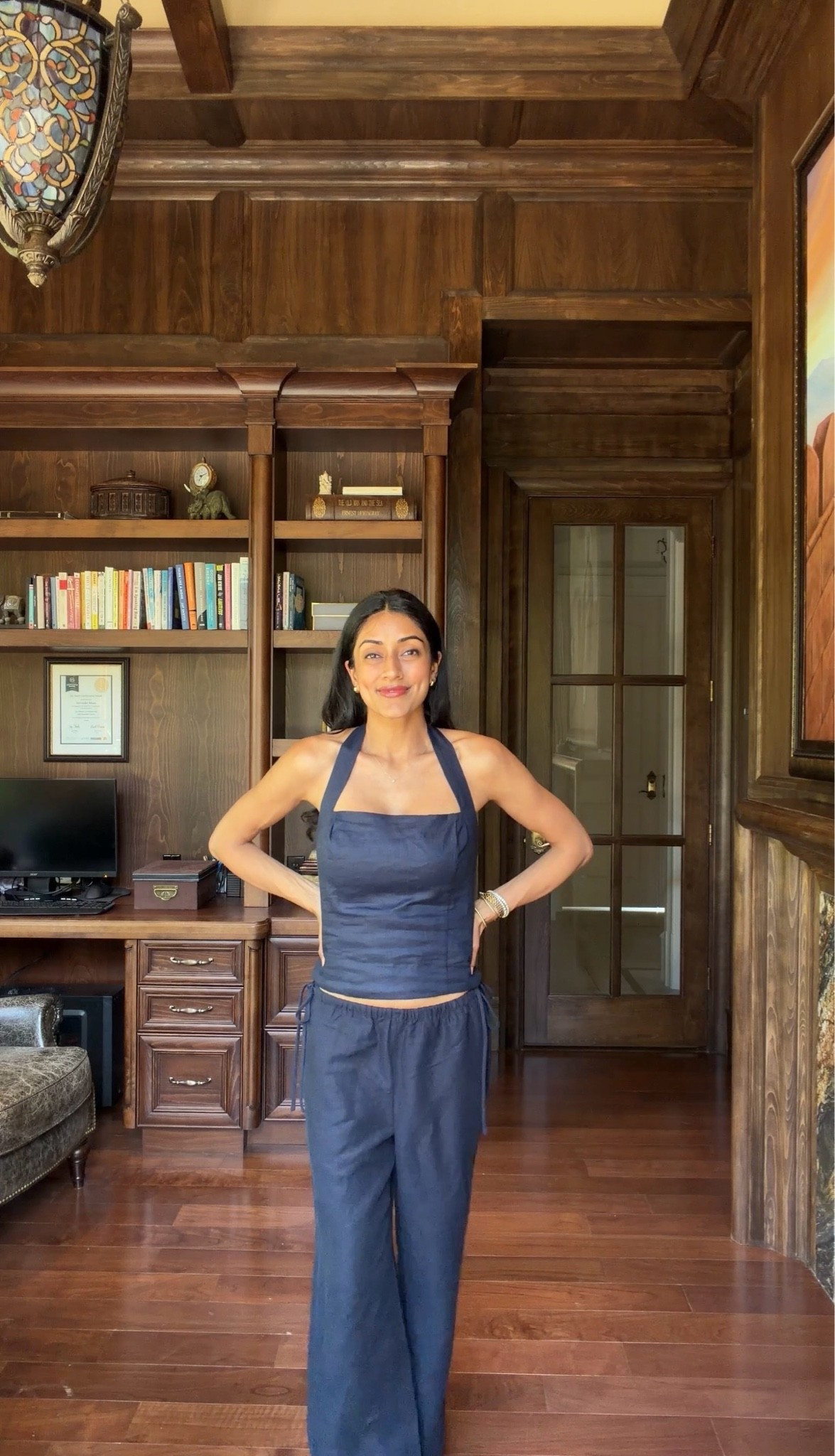 Wearing the whisper halter top and artisan pants in a size small! Love this navy color, perfect for mom life @Aritzia #ad #aritziapartner