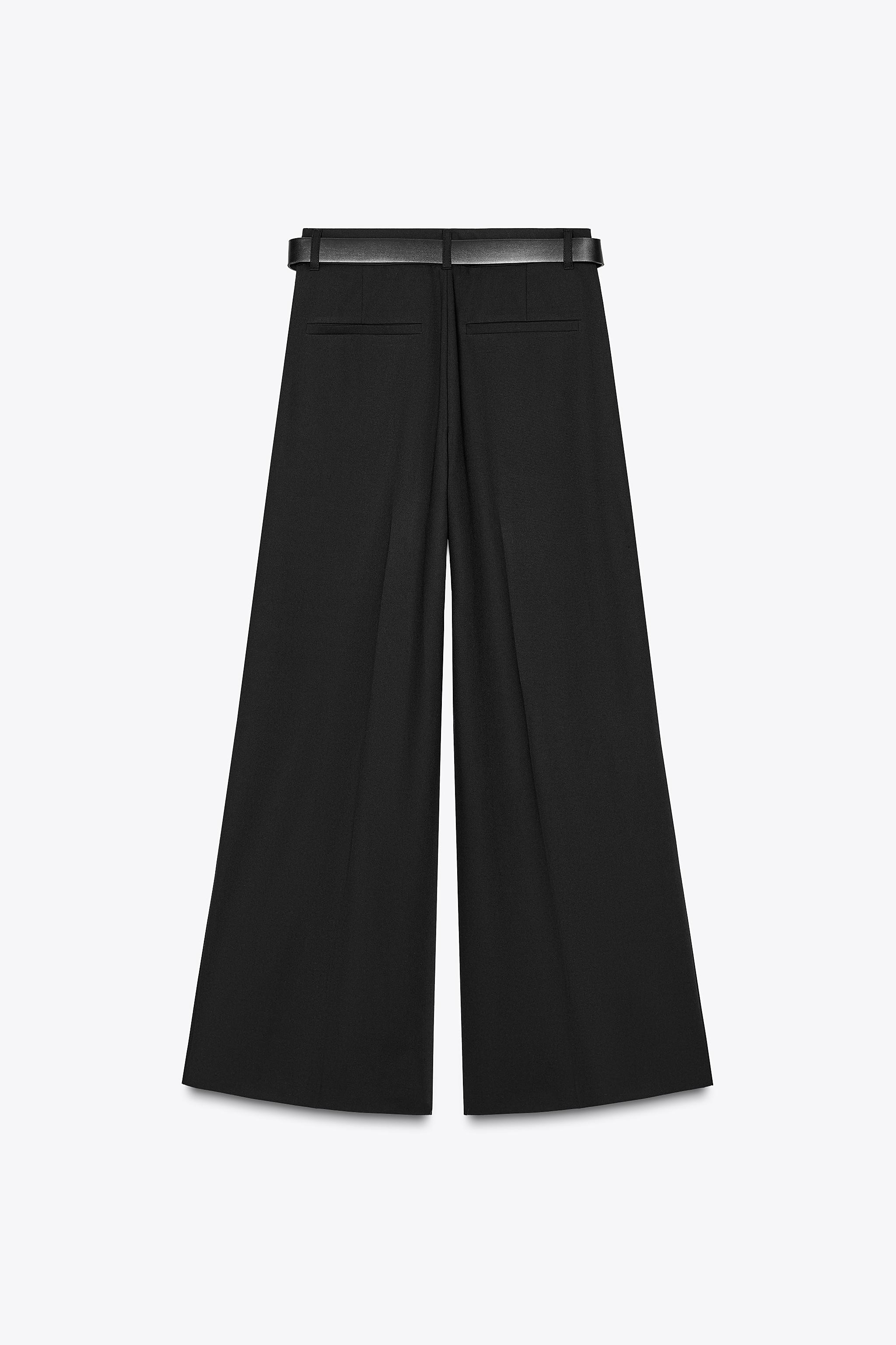 Mid-rise pants with belt loops. Double pleat detail. Side pockets and faux back welt pockets. Con... | Zara US