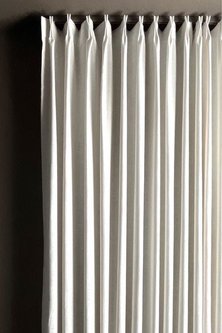 Ivory white pinch pleat custom curtains hung on a ceiling track 

#LTKhome