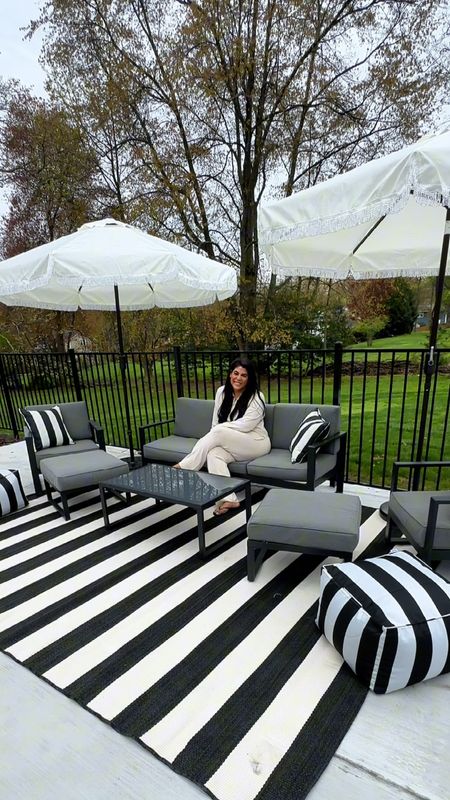 my @walmart patio backyard setup is almost complete! I am loving these cabana vibes with the neutral black & white classic look — this patio set is affordable & I am loving these fringe umbrellas under $100 from walmart home! Wow wow wow! better homes & gardens has stepped it up — this outdoor rug is the 9x12 version but there are plenty of other options & I love these outdoor bean bags too! Not to mention the striped outdoor pillows — 10/10! Can’t wait to show y’all more soon! #walmartpartner #walmarthome 

#LTKVideo #LTKhome #LTKSeasonal