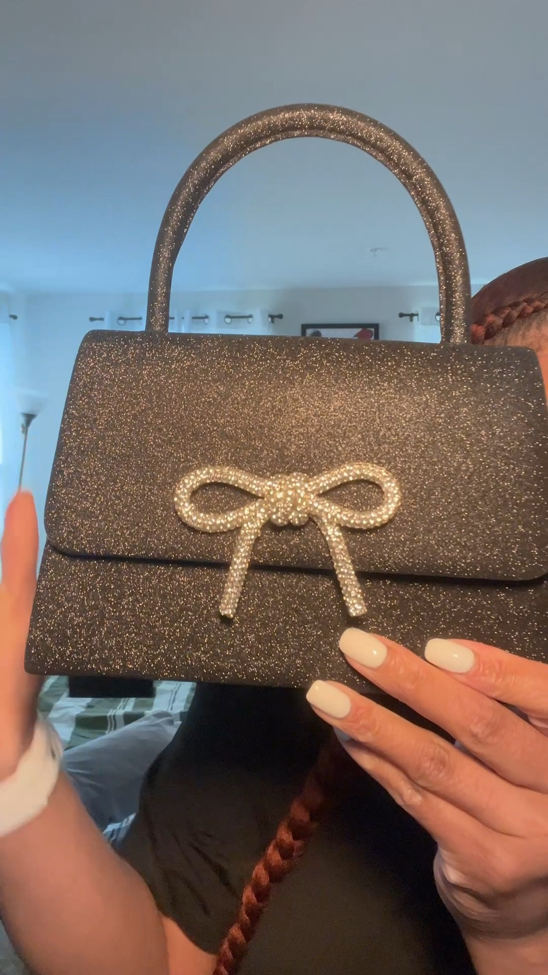 This is the cutest black clutch with silver accessory ￼

#LTKWedding