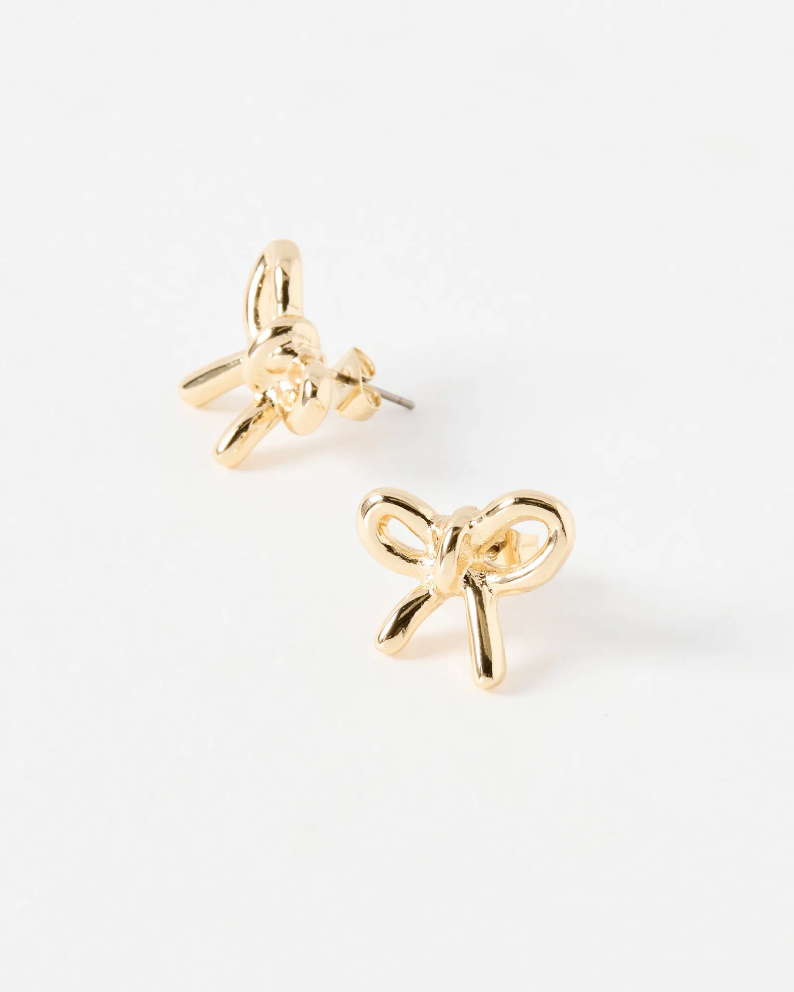 Kylie Ribbon Bow Gold Tone Stud Earrings | Oliver Bonas (Global)
