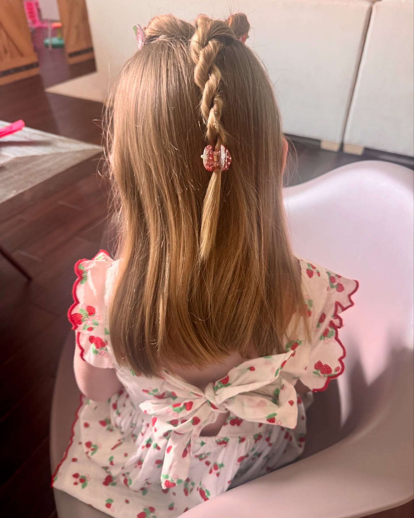 My strawberry girl 🍓 

This is a great easy and quick hairstyle for school days - just divide front hair into 2 sections at part and secure with 2 hair bands. Twist each side towards the face and start to overlap them.  Continue twisting and overlapping until you create a cute twisted pony. Secure with matching hair clips ! 

I will tag this adorable Spring dress and strawberry hair clips on my @shop.ltk today! 

#summeroutfits #girlshairstyles #girlsoutfitideas #strawberryseason #springdtessing #easterdress