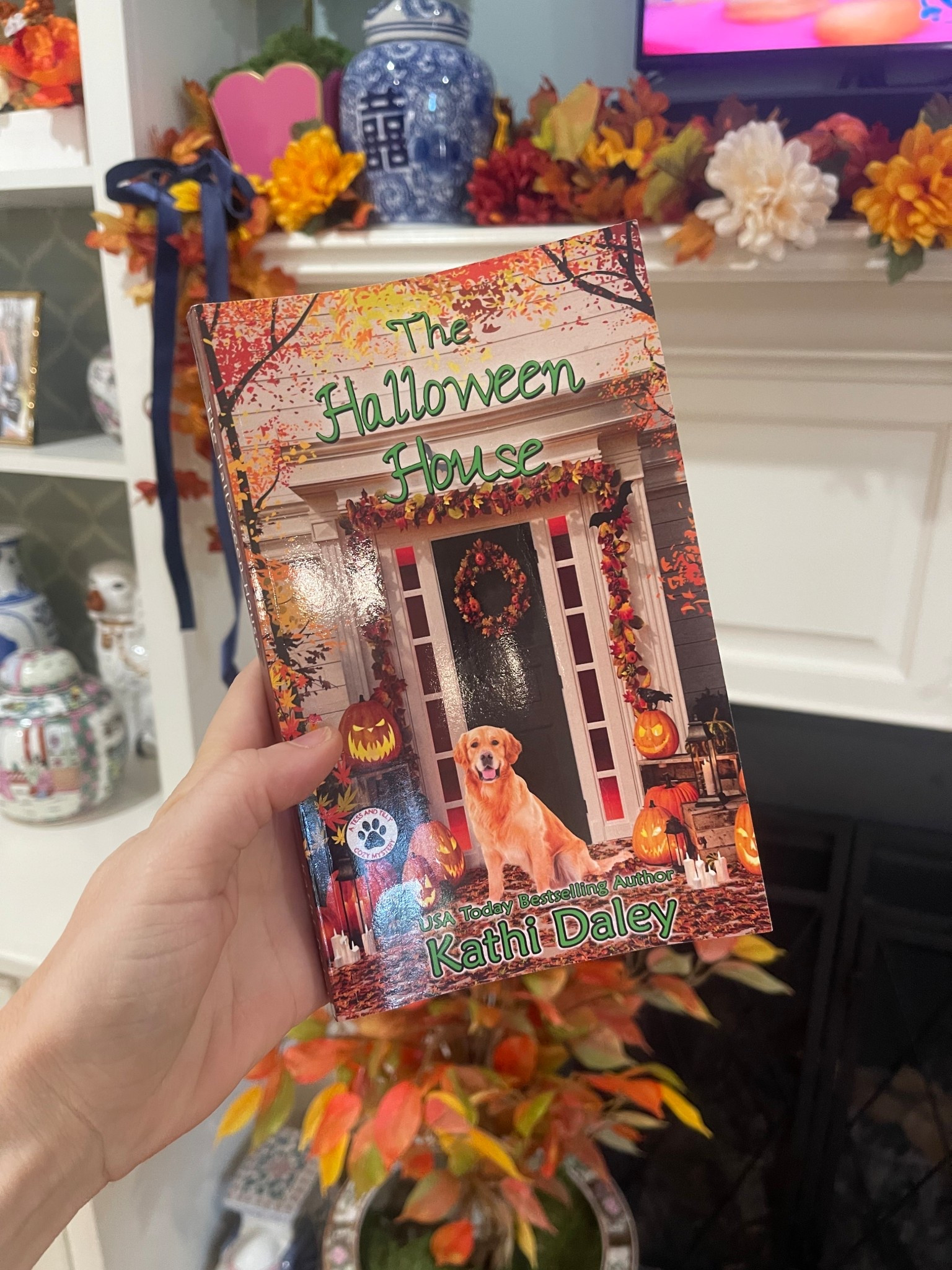 🎃🍂 Cozy fall evenings call for a seasonal read by the fire! I just started The Halloween House by Kathi Daley, a festive cozy mystery perfect for autumn lovers. 🕯️📖 With charming Halloween decor, pumpkin-lit porches, and even a sweet pup on the cover, it sets the perfect mood for sweater weather nights. 🍁🐾

I’ve styled it here alongside our fall mantel decorated with garlands, chinoiserie, and pops of orange + gold for that classic-preppy seasonal look. 🍂✨ Whether you’re decorating your home for Halloween or looking for an easy fall read, this book pairs perfectly with pumpkin spice candles and cozy throws. 🧡

👉 Linked The Halloween House and more fall decor + reads to bring the autumn spirit into your home.

✨ Shop fall cozy reads + home accents here! 📚🍁🕯️

#LTKFindsUnder100 #LTKHome #LTKFindsUnder50