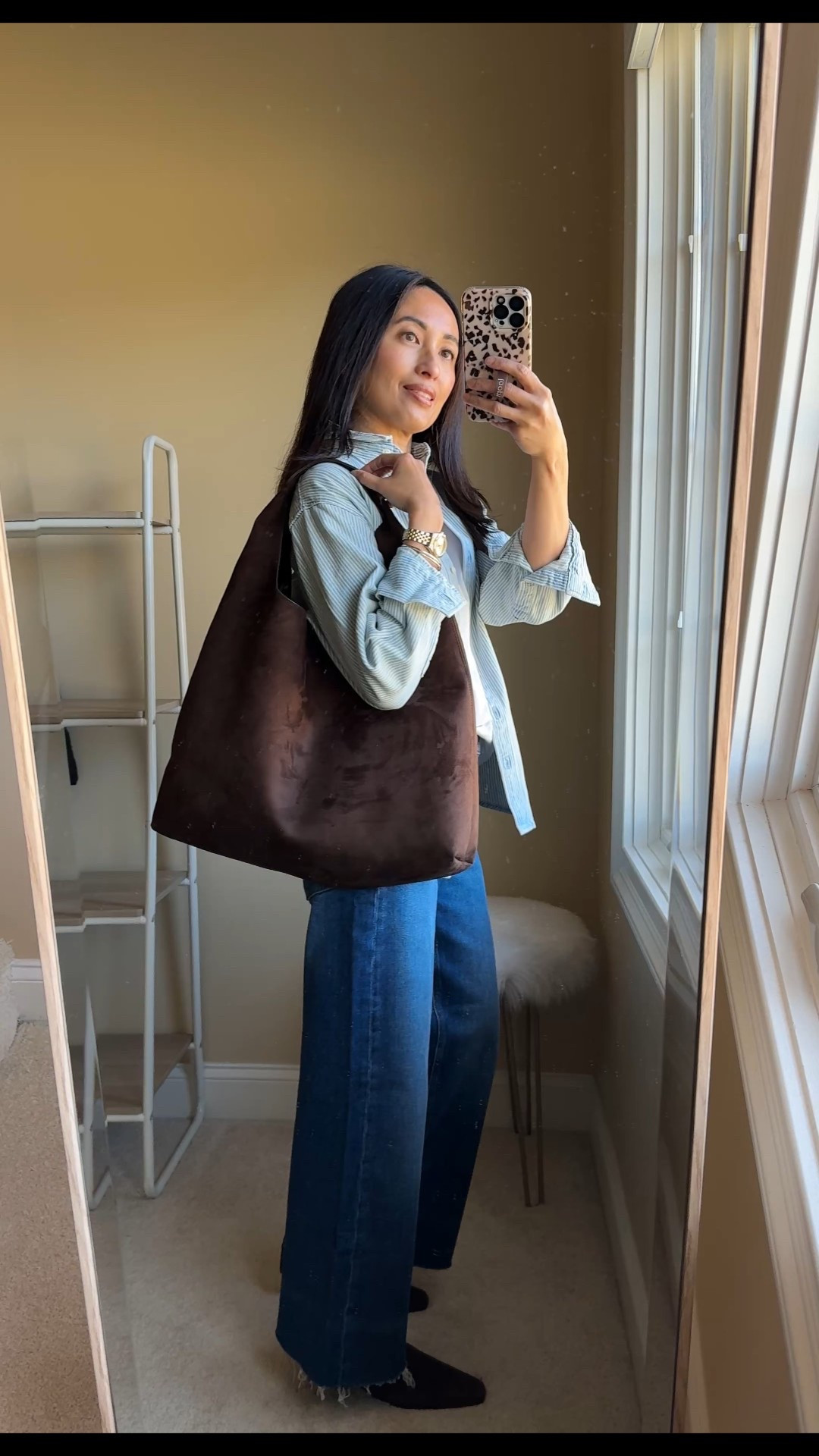 Denim on Denim outfit idea with classics from @gap #GapPartner 
Light denim shirt with dark denim jeans. Made a little more casual with a t-shirt underneath and denim shirt worn open like a jacket. Tote bag is done in faux suede and has a chic slouchy shape. 
Shirt, t-shirt, jeans, and bag are currently 50% off. 
- Exact shirt is done in their classic “Big Shirt” oversized cut and has classic railroad stripes. Material is substantial 100% cotton that functions like a jacket. 
True to size. 
- Exact t-shirt is also 100% cotton. 
True to size. 
- Exact jeans are high-rise wide-leg jeans are 99% cotton and 1% stretch. 
Showing true to size, but I could also size up  
- Exact bag is in shade chocolate cake brown. 


#LTKFindsUnder100 #LTKootd #LTKOver40