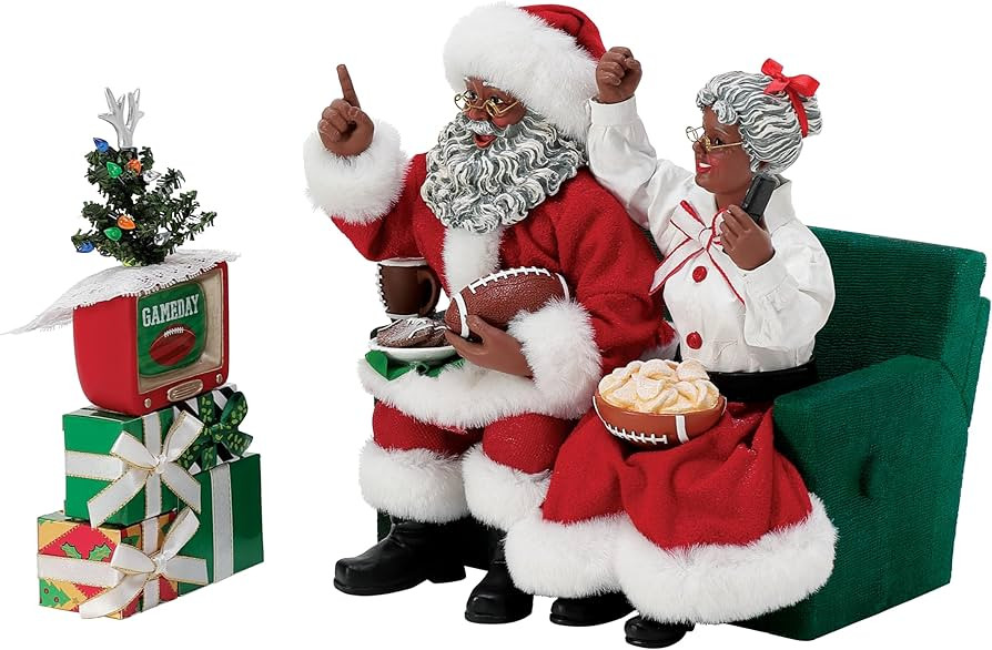 Department 56 Possible Dreams Sports and Leisure Santa and Mrs. Claus Binge Watching Football Fig... | Amazon (US)