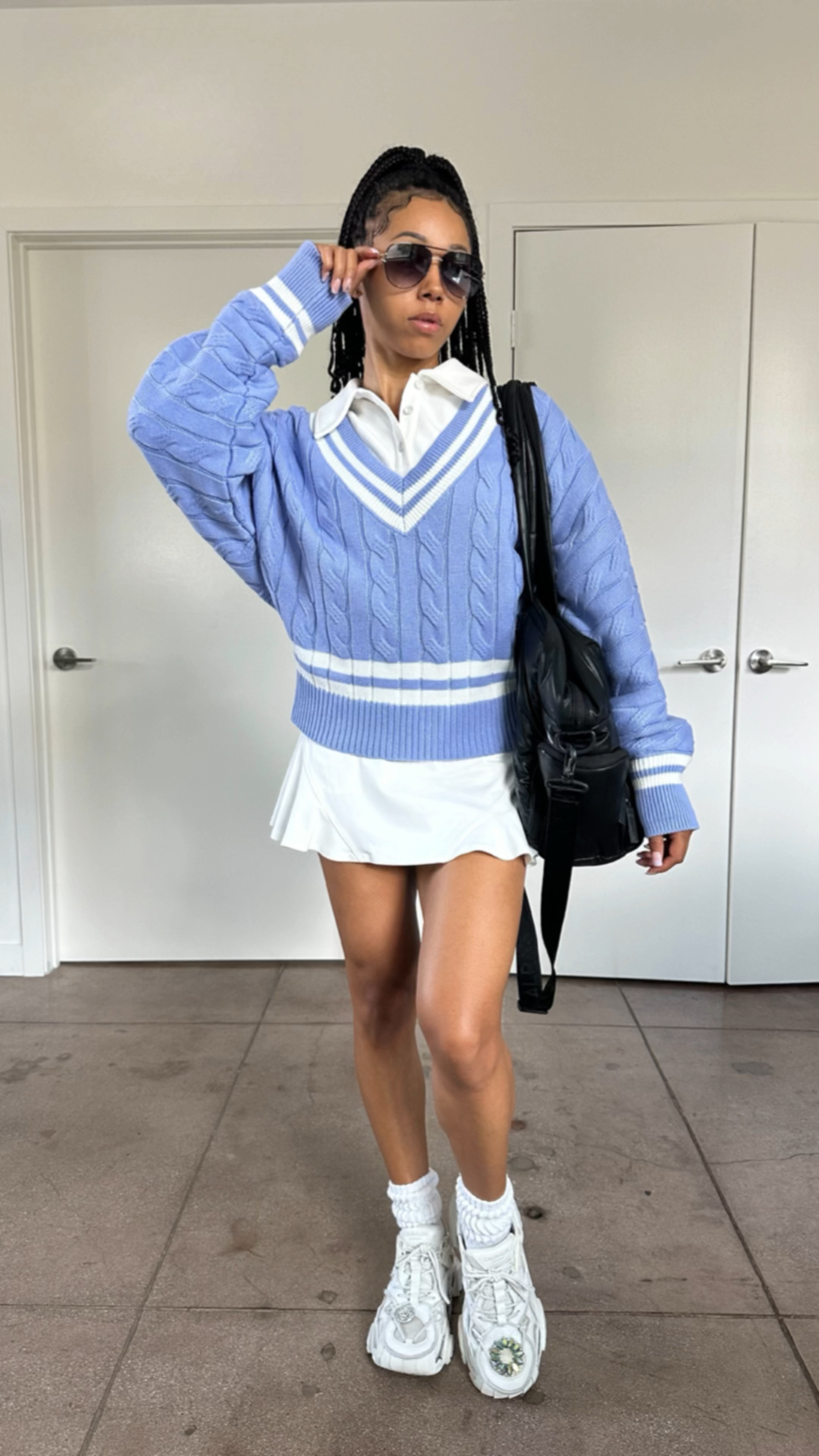 would you wear this? 💜📚👜🤍

polo, sweater & skirt @wiskiiactive 
bra @wearpepper (use code: imanilw)
socks @losangelesapparel 
sneakers @calvinklein 
bag @calpak 
glasses @quayaustralia 
jewelry @henribendel 
perfume @burberry (her blossom)

#LTKFamily #LTKActive #LTKVideo