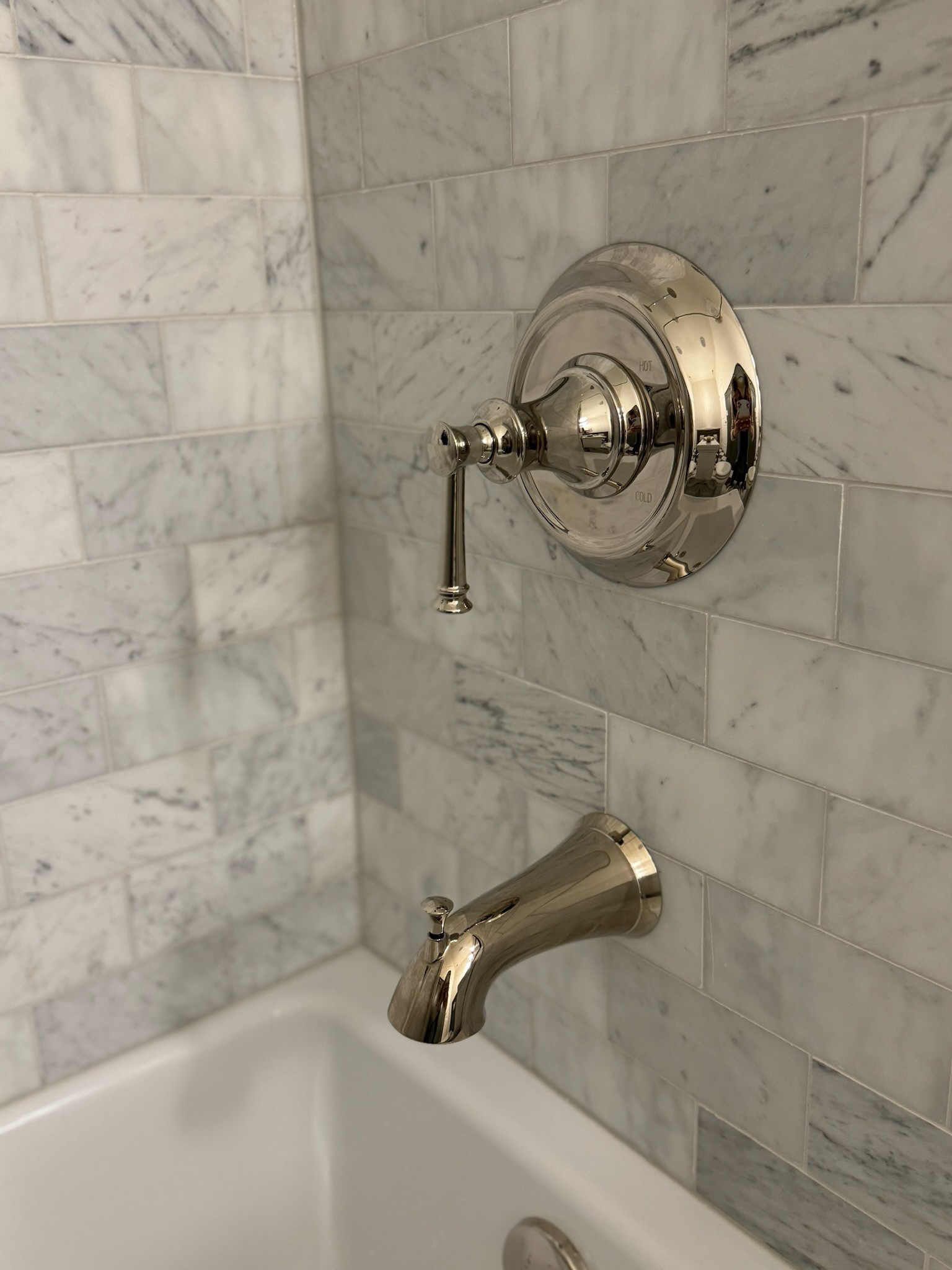 A better look at the new features in our guest bath! The tile is from Wayfair! It’s a 3”x6” Carrara white marble tile, and all our plumbing is polished nickel by Signature hardware! We used the color light pewter for the grout!