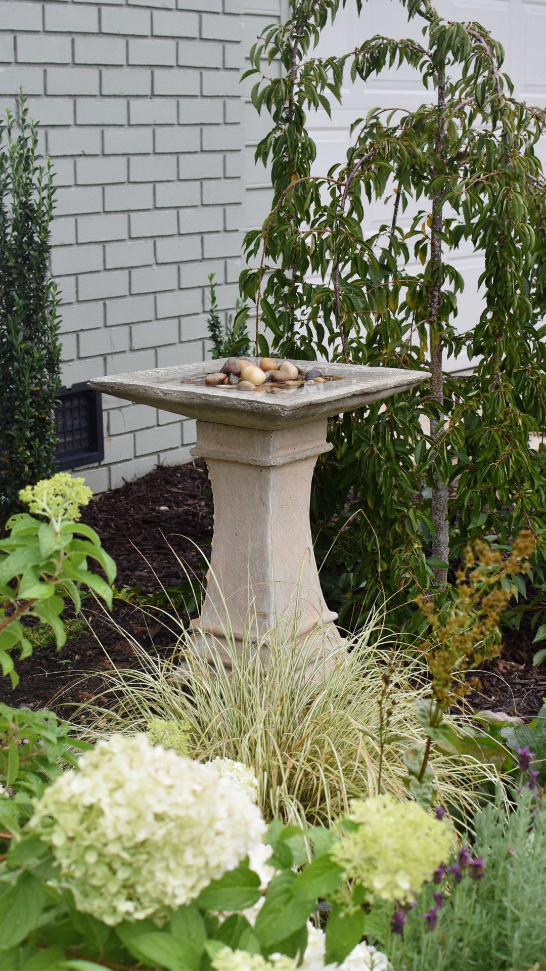 Y’all won’t believe how affordable this concrete bird bath is!! I love the size and shape. It adds such structure to my cottage garden, and water for our birds & pollinators. I added a copper plate to keep algae away and stacked smooth stones for our feathered friends. Connor picked this up for me in-store the same day!

#LTKSeasonal #LTKHome