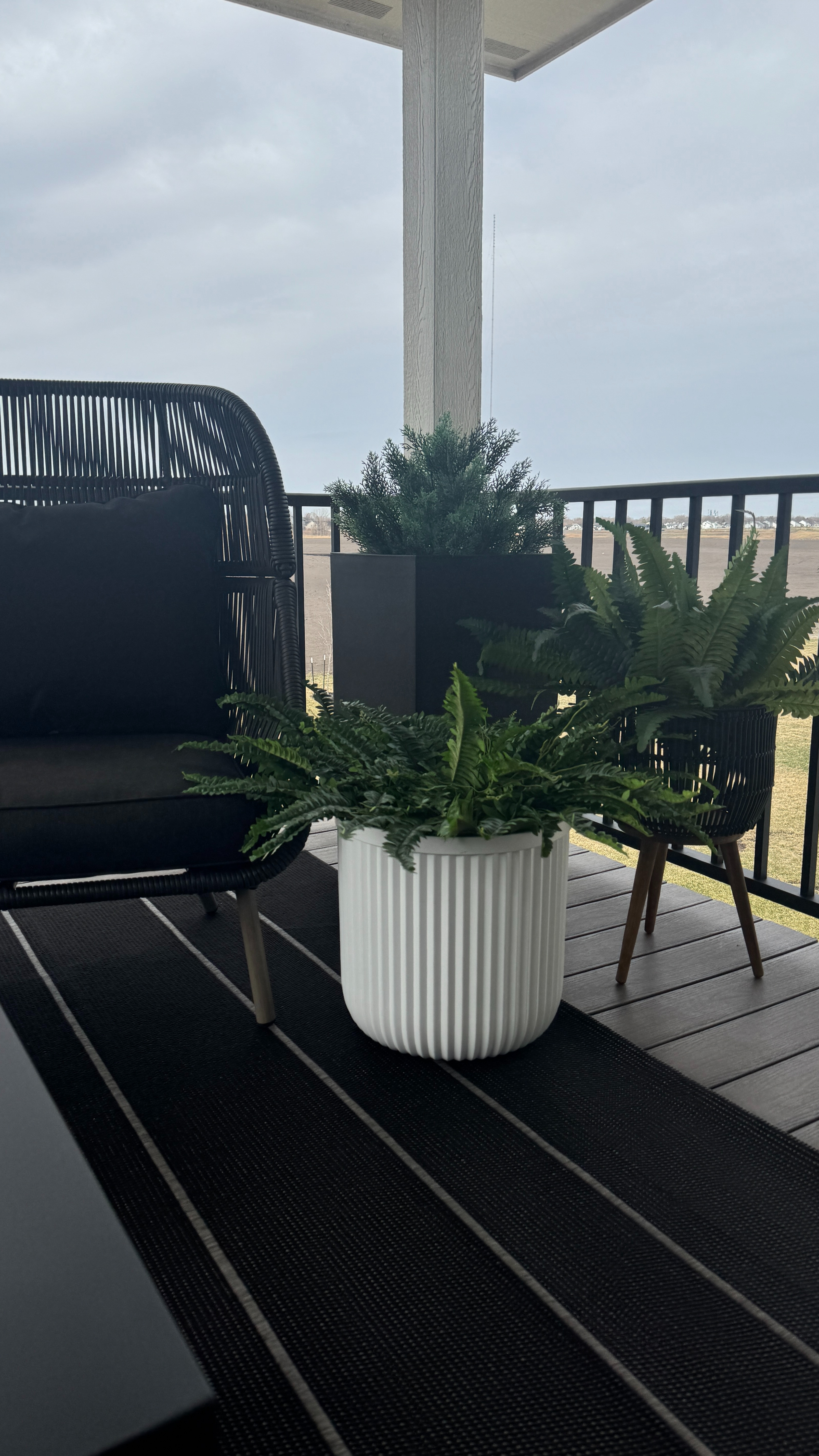 My Walmart planter is back in stock 🤍 The perfect Pottery Barn look for less. I love it on my patio with the faux ferns, other planters and faux plants, black patio chair, rug and fire pit table! 

 #LTKSeasonal #LTKHome