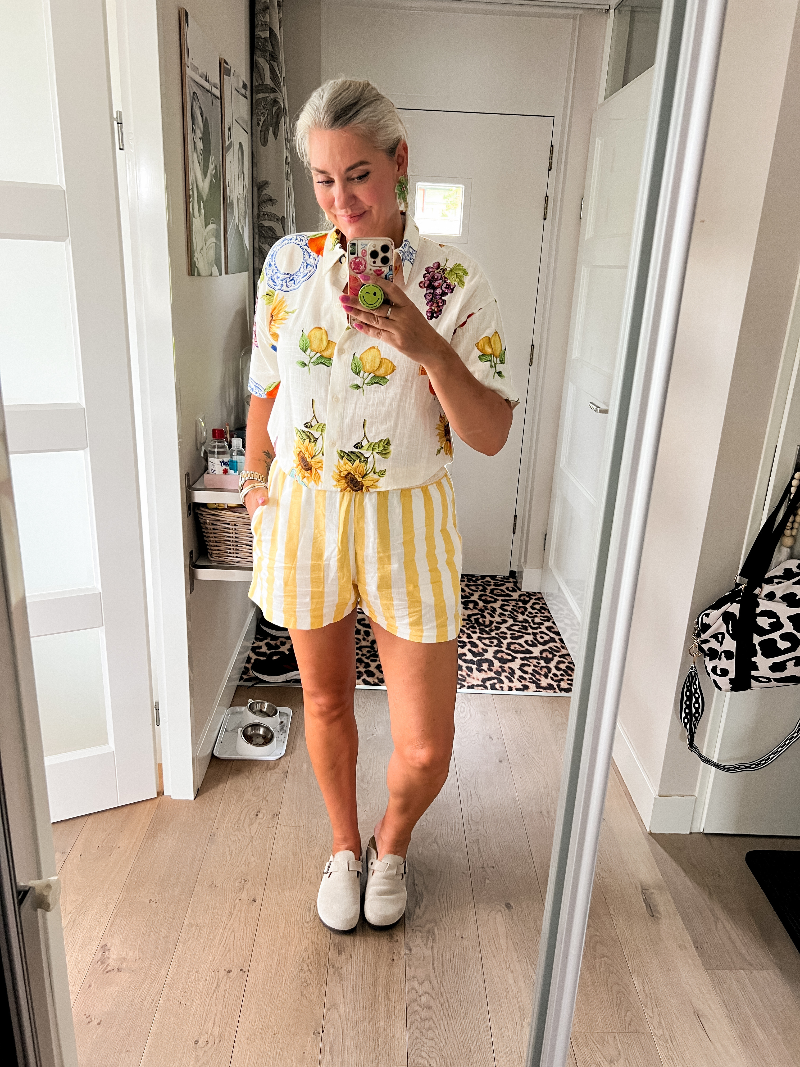 Ootd - Sunday. Sunday Fun day. Not going anywhere, just lounging around the house wearing yellow linen-blend striped shorts, linen-blend cropped short sleeve blouse with fruit and floral print and Birkenstock Botson clogs and palm tree earrings.

 

 #LTKnederlands #LTKeurope #LTKsummer