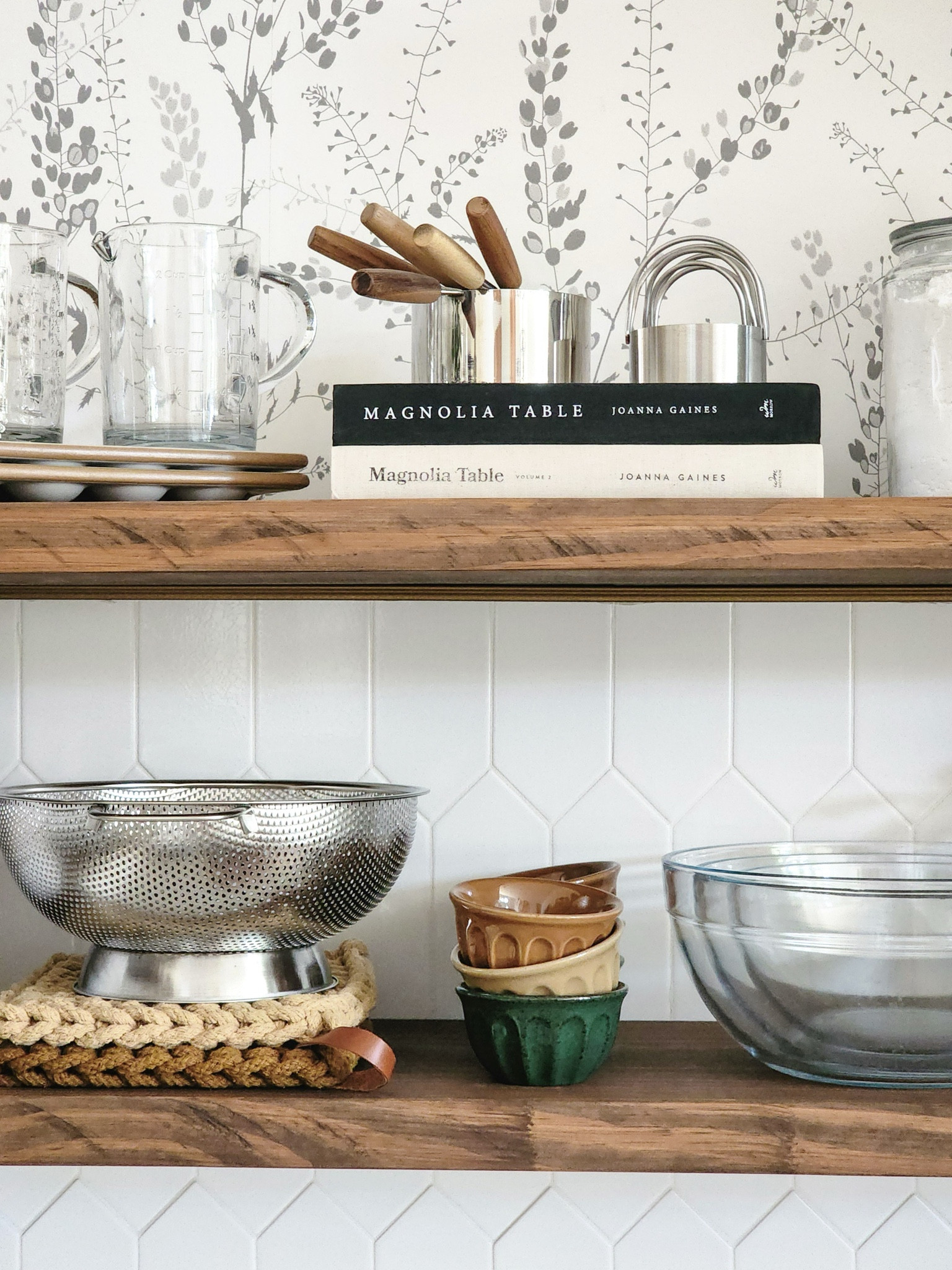 My rule of thumb for styling our open kitchen shelves is to use everyday, functional items like mixing bowls, pinch bowls, trivets, and colander on the lower self and less used and decorative items like large measuring cups, biscuit cutters, recipe books, deviled egg trays, and baking ingredients on the top self.

#LTKFindsUnder50 #LTKSeasonal #LTKHome