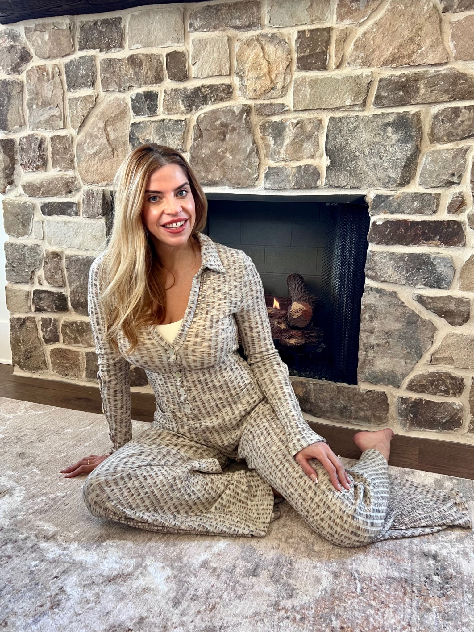 Winter vibes aren’t over just yet! ❄️ I’m soaking up every last cozy moment with this super comfy jumpsuit by the fireplace. There’s nothing like staying warm and stylish during the chilly days. 🌟 

Snuggle up, sip something warm, and treat yourself to ultimate comfort. 🖤 Want in? Tap to shop! #CozySeason #WinterStyle #LTKStyle 

#LTKOver40 #LTKStyleTip #LTKSeasonal