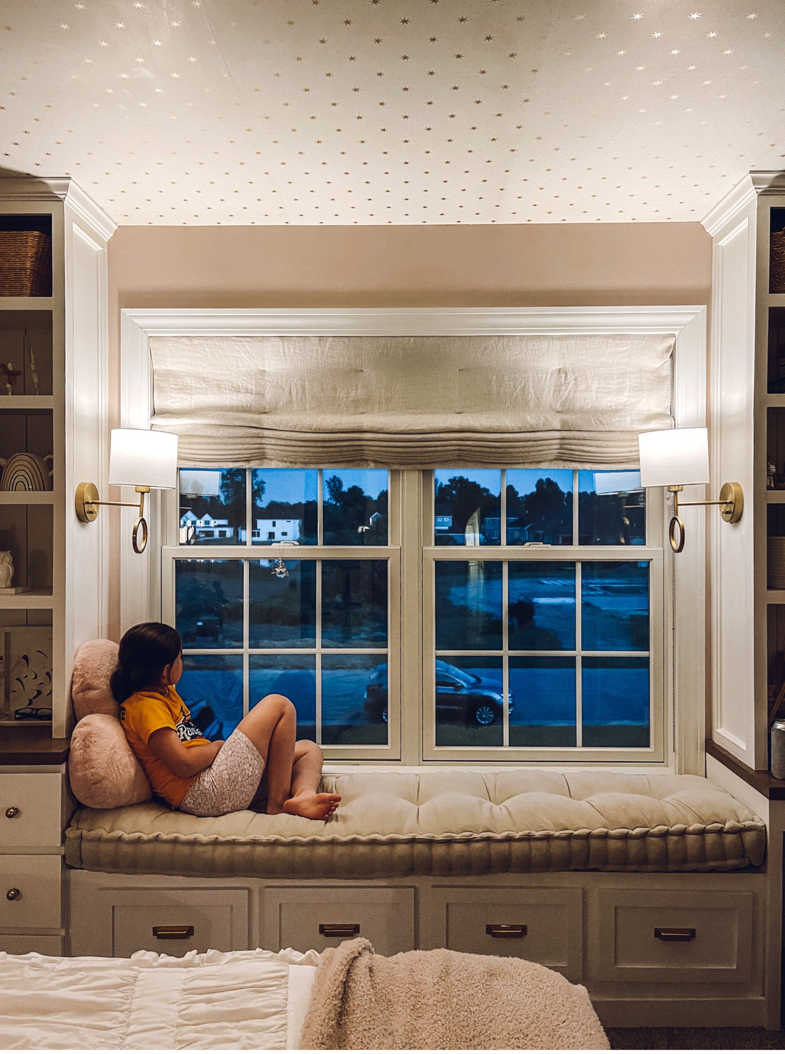 Kids bedroom decor idea - window bench with a cushion, sconces and Roman shade . 
French mattress, Etsy home decor, linen Roman shade, Target sconces, Anthropologie home decor 

#LTKhome #LTKkids #LTKFind