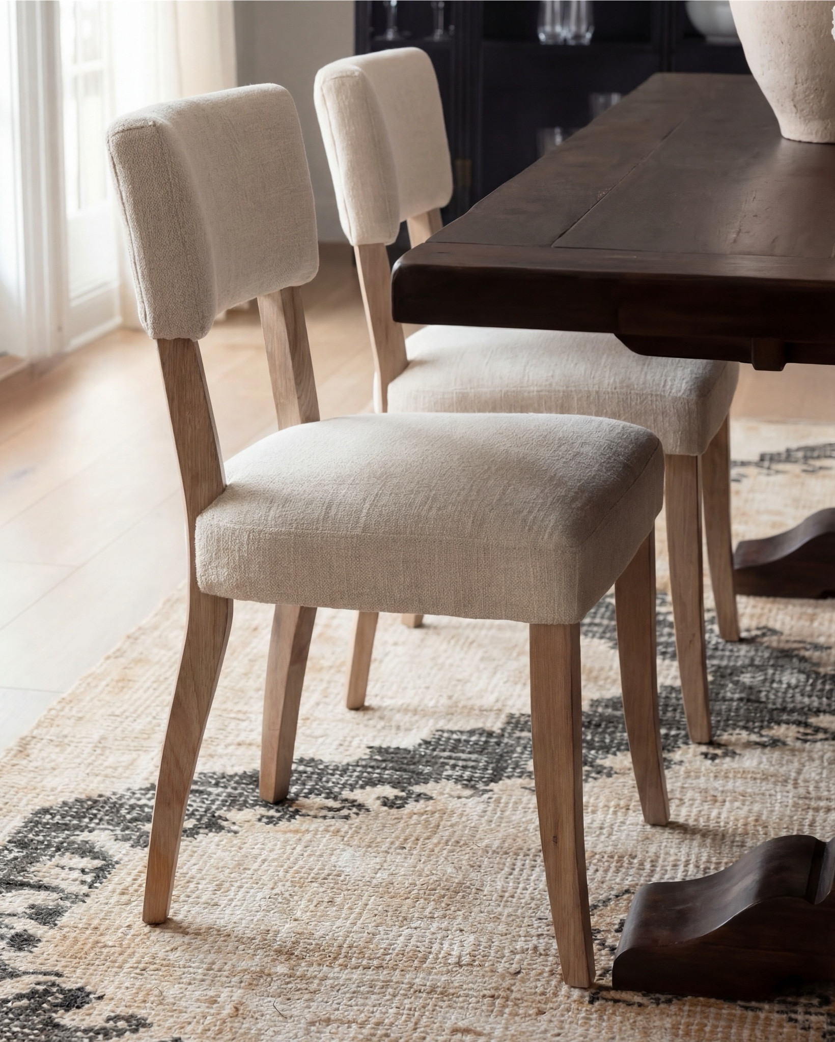 Shop the Look:
• Dark wood pedestal dining table
• Cream upholstered dining chairs with light wood legs
• Large neutral area rug with charcoal medallion pattern
• Black arched display cabinet / hutch
• Light wood sideboard / buffet cabinet
• Large ceramic floor vase (neutral tone)
• White ceramic bowl with white florals (peonies or roses)
• Pink faux cherry blossom stems in white vase
• Neutral ceramic table lamp with white shade
• Tall brass wall sconces with glass detailing
• Framed botanical artwork (set of four)
• Dark abstract wall art (large statement piece)
• White decorative vases (assorted sizes)
• Light linen curtains

#LTKSaleAlert

#LTKsale #LTKhome