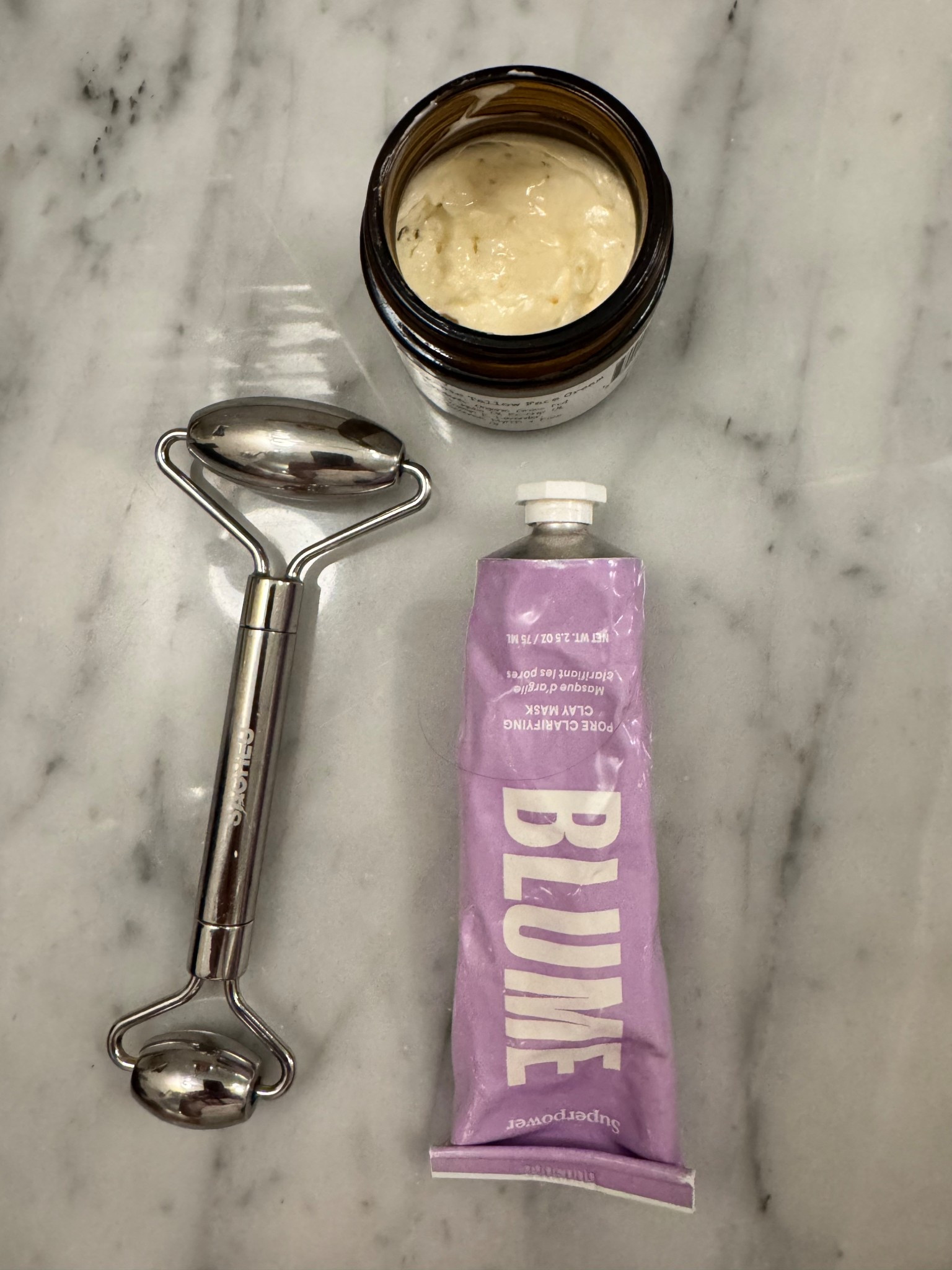 Simple, clean skin care. Clay clarifying mask, stainless steel face roller, and whipped tallow. #cleanbeauty #cleanskincare #nontoxskincare