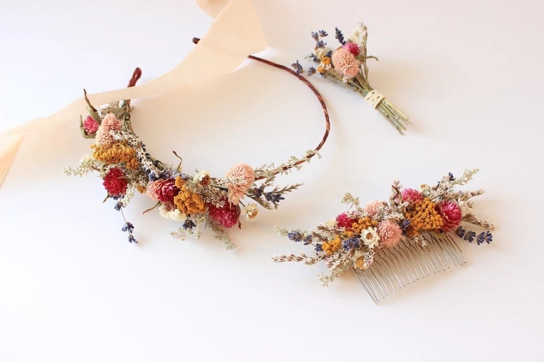 The Petite Juliet flower crown is a delicate, romantic accessory perfect for destination weddings, engagement photos, and whimsical flower girl moments. Handcrafted with globe amaranth, preserved daisies, German statice, and cheerful yellow yarrow, this lightweight crown adds a beautiful pop of color and natural texture. Designed to fit most head sizes, it can be worn across the front, back, or as a dreamy floral accent. #DriedFlowerCrown #BridalCrown #FlowerGirlCrown #EngagementPhotos #BohoWedding #PreservedFlowers #DestinationWedding #LTKWedding #FloralAccessories #WeddingInspiration

#LTKSeasonal #LTKWedding