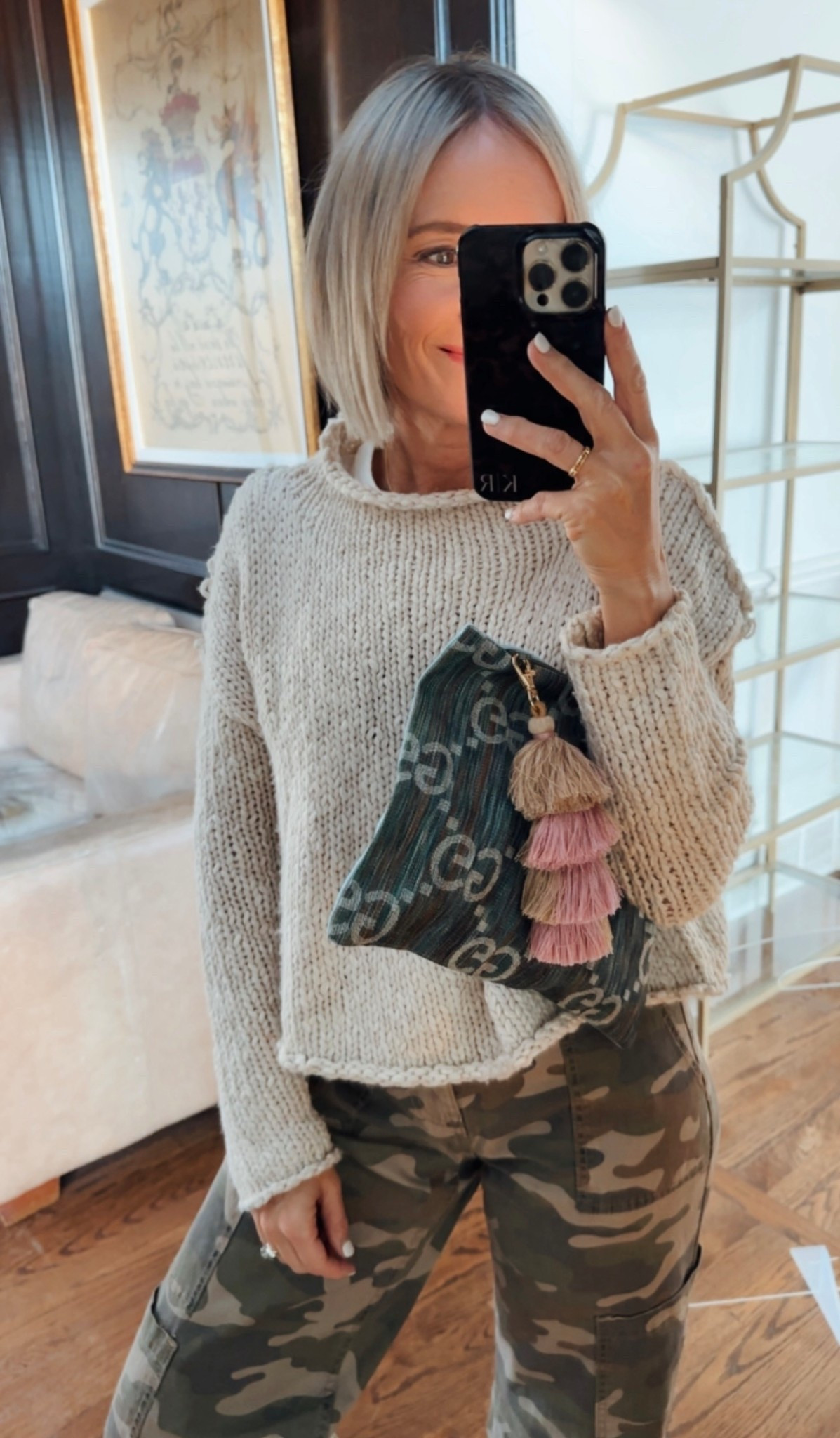 my fave sweater that i reach for all the time
wearing with my camo pants to meet friends out and a GG clutch made by Miami buy the Bag on IG

#LTKOver40