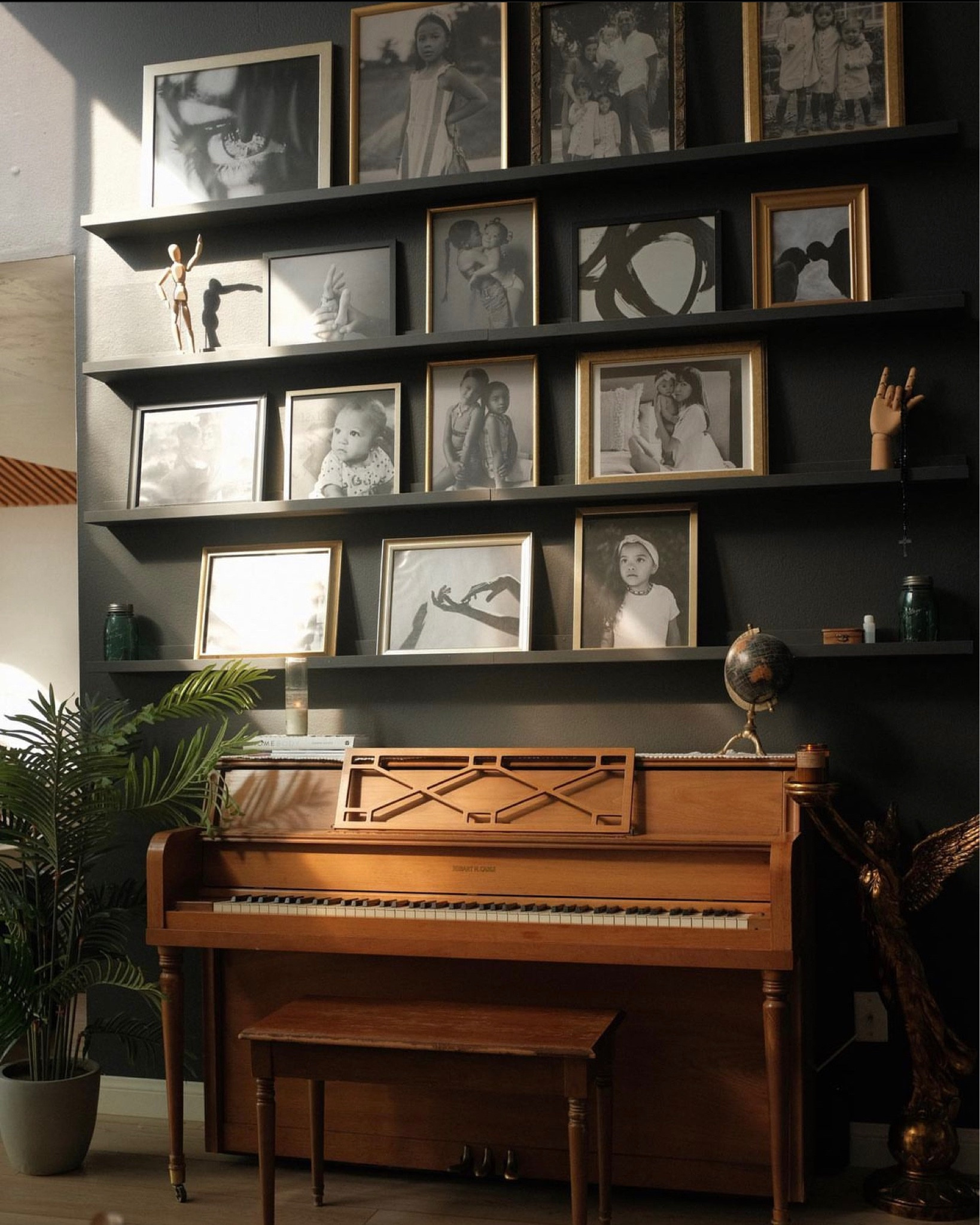 Favorite wall in the house 🏡 This photo gallery wall made using IKEA picture ledges is the perfect way to add in family photos to your decor. Black & white is the key to color consistency 👌 

#LTKfamily #LTKhome #LTKfindsunder100