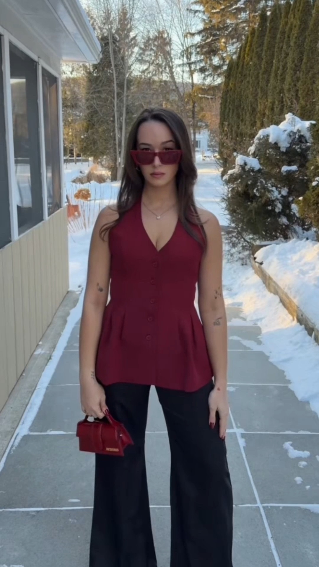 Obsessed is still an understatement ❤️‍🔥

This burgundy halter vest top from Tobi (wish I could link it here 😭) is THAT structured, snatched, boss energy piece. The fit is so flattering and holds everything in perfectly — it’s giving confident, put-together, effortlessly elevated.

Paired with wide leg satin black trousers for that sleek, powerful silhouette… and once you see it outside in natural light? Even better. The deep red tone hits different.

I linked my red mini bag + sunnies because they pull the whole look together and make it feel extra polished.

This outfit is giving:
✨ Power lunch energy
✨ City night out
✨ “I have plans” look
✨ Elevated winter-to-spring transition
✨ That girl but in a chic, grown way

Everything I could link is right here 🖤

#LTKSeasonal #LTKWorkwear #LTKootd
