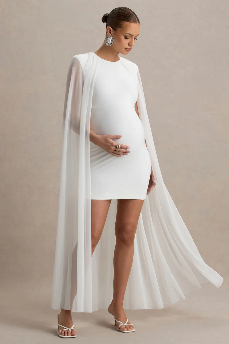 Charlene  White High-Neck Maternity Mini Dress With Mesh Cape | Club L London