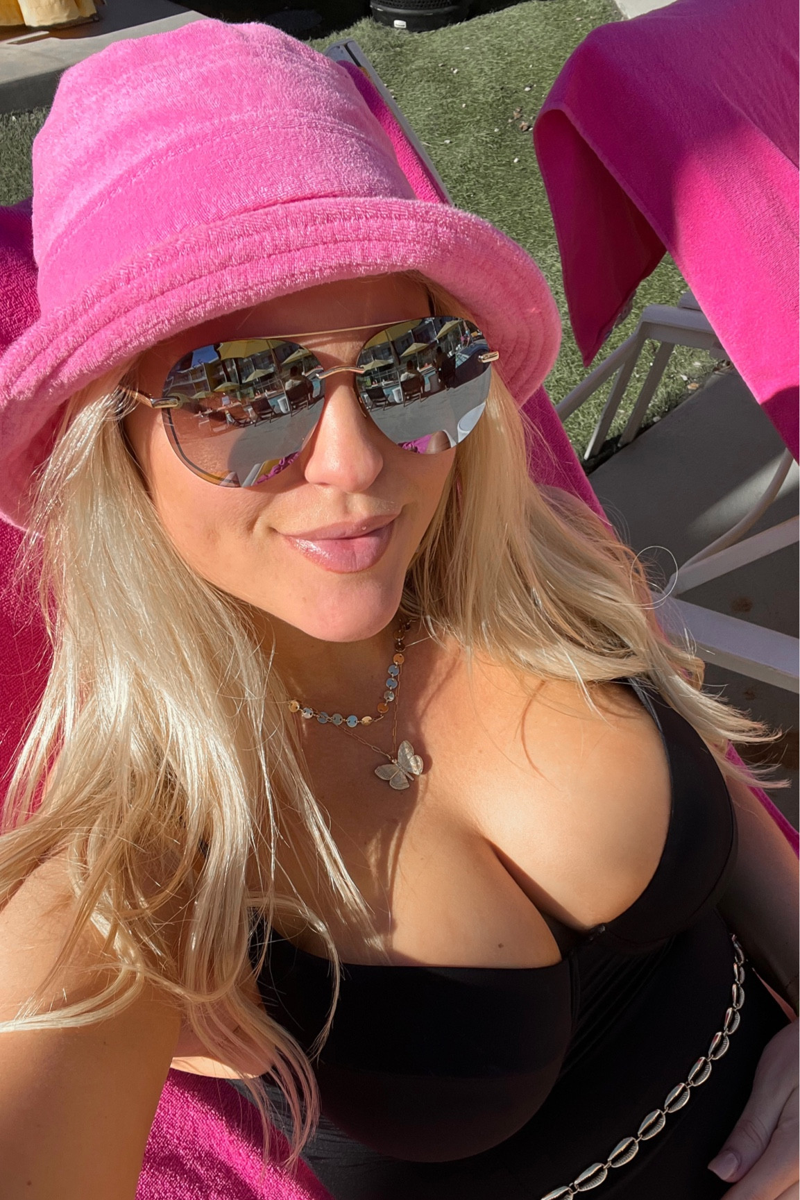 Butterfly necklace, aviators, black belted one piece 