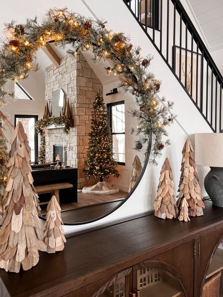 Holiday cabinets and round mirror styling with garland . 

#LTKHoliday #LTKSeasonal #LTKhome