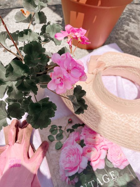 Pretty garden hats 
Terracotta pots
Pink garden gloves 
Roses book 
Pink geraniums 


#LTKSeasonal #LTKhome #LTKFind