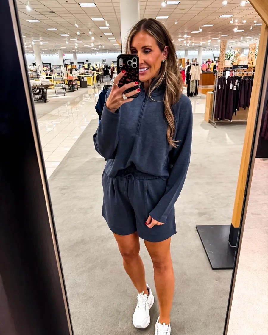 This navy shorts set is exactly what I want for travel days and casual weekends. The lightweight fabric has a soft drape, the half zip gives the top a sporty shape, and the relaxed drawstring shorts make it comfortable without looking like pajamas.

Size M

navy matching set, shorts set, half zip top, casual travel outfit, comfortable summer style, sporty set, weekend outfit, white sneakers, women over 40 fashion, TheMomInStyle

#LTKootd #LTKTravel #LTKSeasonal