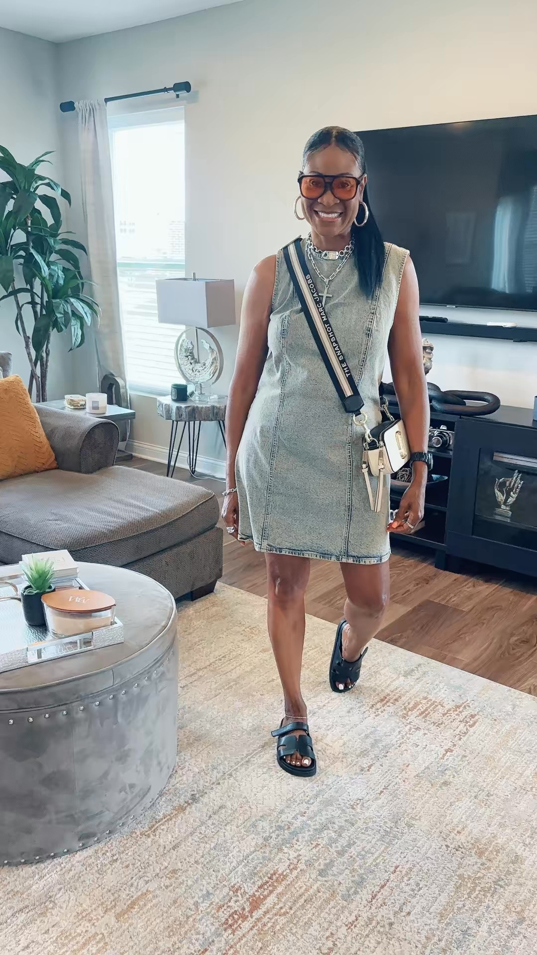 Easy, effortless, and stylish! This sleeveless denim mini dress is the perfect one-and-done outfit for summer. I paired it with comfy black slide sandals, a chic crossbody bag, oversized sunnies, and layered silver jewelry for a polished casual look.

#LTKdayinmylife #LTKootd #LTKgrwm