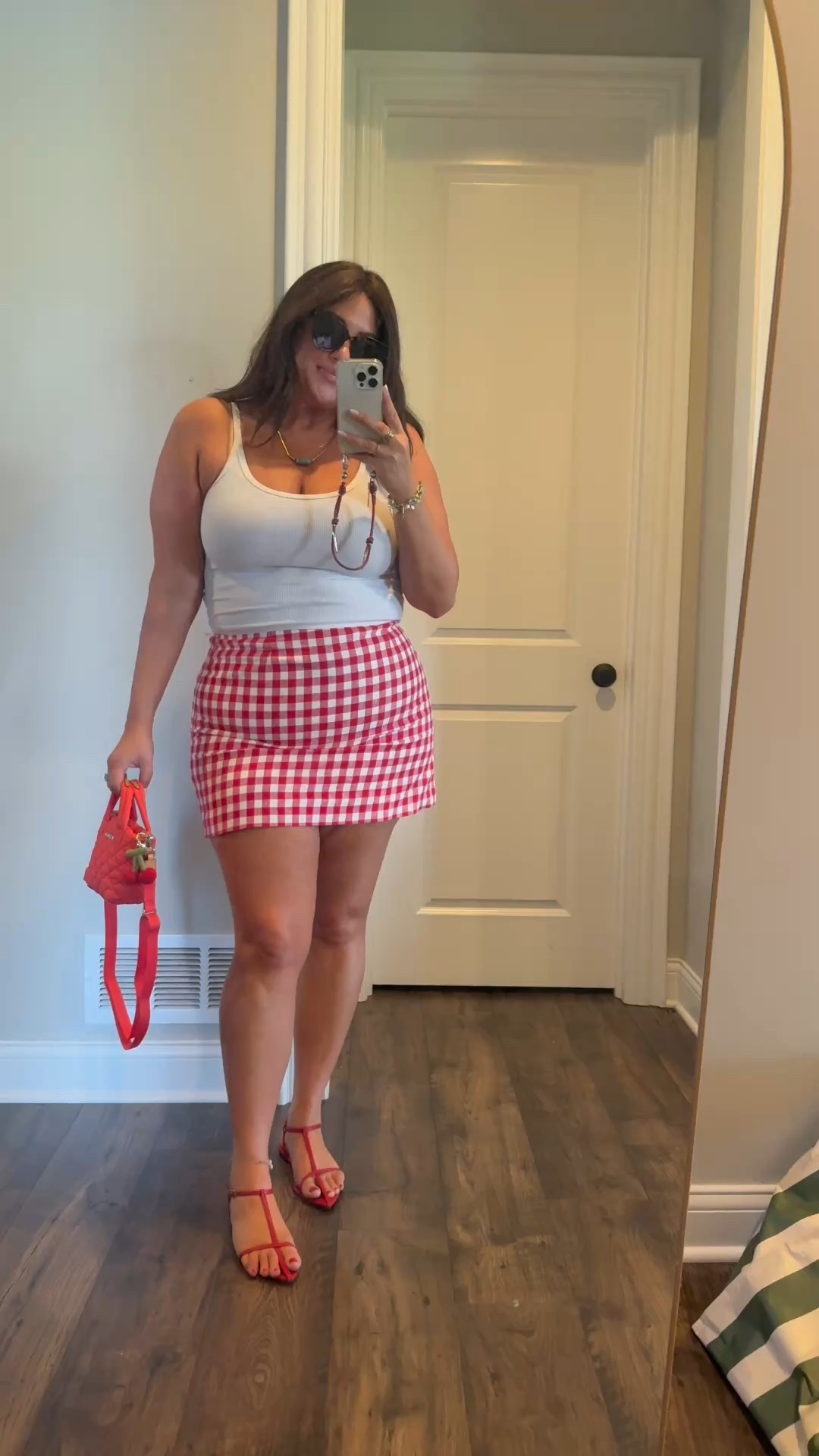 Absolutely adorable skirt that is affordable. With my favorite Amazon tank and shoes. Size down in tank, this is cropped style. Skirt true to size. Size down half size in sandals. Bag is adorable. 