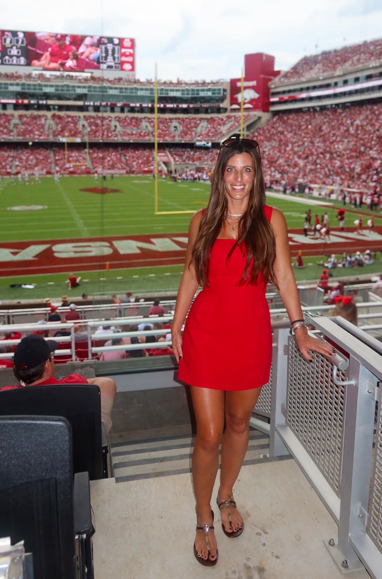 Razorback gameday outfit inspo 🏈🐗 | First football game of the season & celebrating a big win in this chic red mini dress and designer accessories! Game day style – perfect for SEC football, tailgates, and stadium vibes. 🔥

✨ Shop the full look:
	•	🔴 Red Square-Neck Mini Dress | Tailgate outfit • Football game dress • Game day style • Fall gameday dress • College gameday outfit
	•	👡 Gucci Metallic Sandals | Designer sandals • Luxury flat sandals • Minimalist thong sandals • Summer-to-fall shoes
	•	🕶️ Classic Aviator Sunglasses | Ray-Ban aviators • Designer sunglasses women • Timeless aviator shades • Fall accessories
	•	💎 Layered Necklace Stack | Gold layering necklace • Minimalist jewelry stack • Everyday jewelry • Game day jewelry trend
	•	🪙 Gold & Silver Bracelet Stack | Mixed metal bracelets • Layered wrist stack • Gameday arm candy • Designer jewelry stack

Razorback Stadium | SEC Football • Arkansas Razorbacks

First football game of the season • Tailgate chic • Stadium style inspo

#GamedayOutfit #SECStyle #FootballGameStyle #TailgateFashion #DesignerSandals #GucciSandals #RedDressStyle #FallOutfitInspo #LikeToKnowItStyle #StadiumOutfit #CollegeGamedayFashion #FootballSeasonStyle #ArkansasRazorbacksFashion

#LTKShoeCrush #LTKSeasonal #LTKOver40