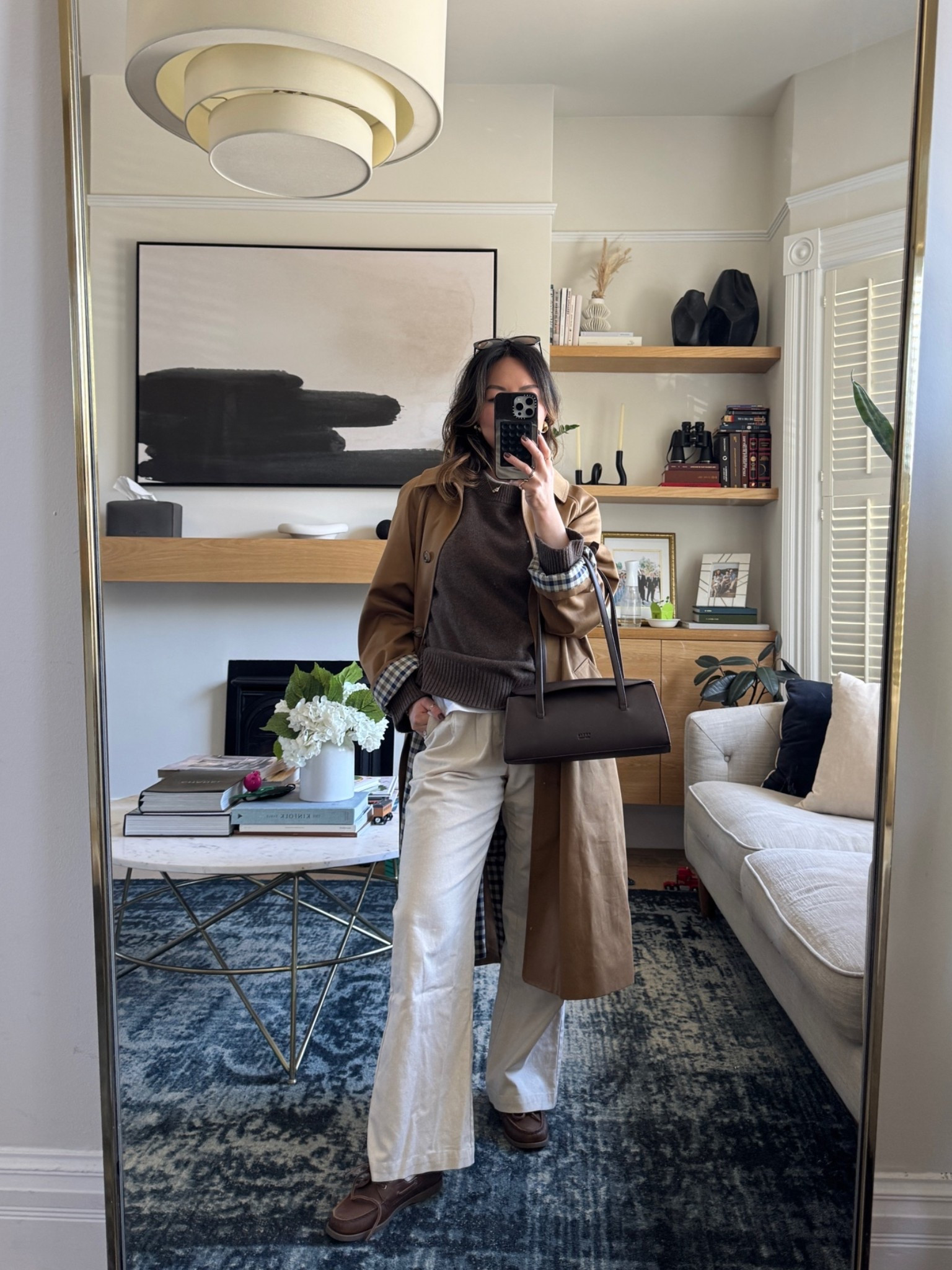 Wearing sizes: 
- Sweater: small 
- Coat: US4 
- Shoes run true to size.