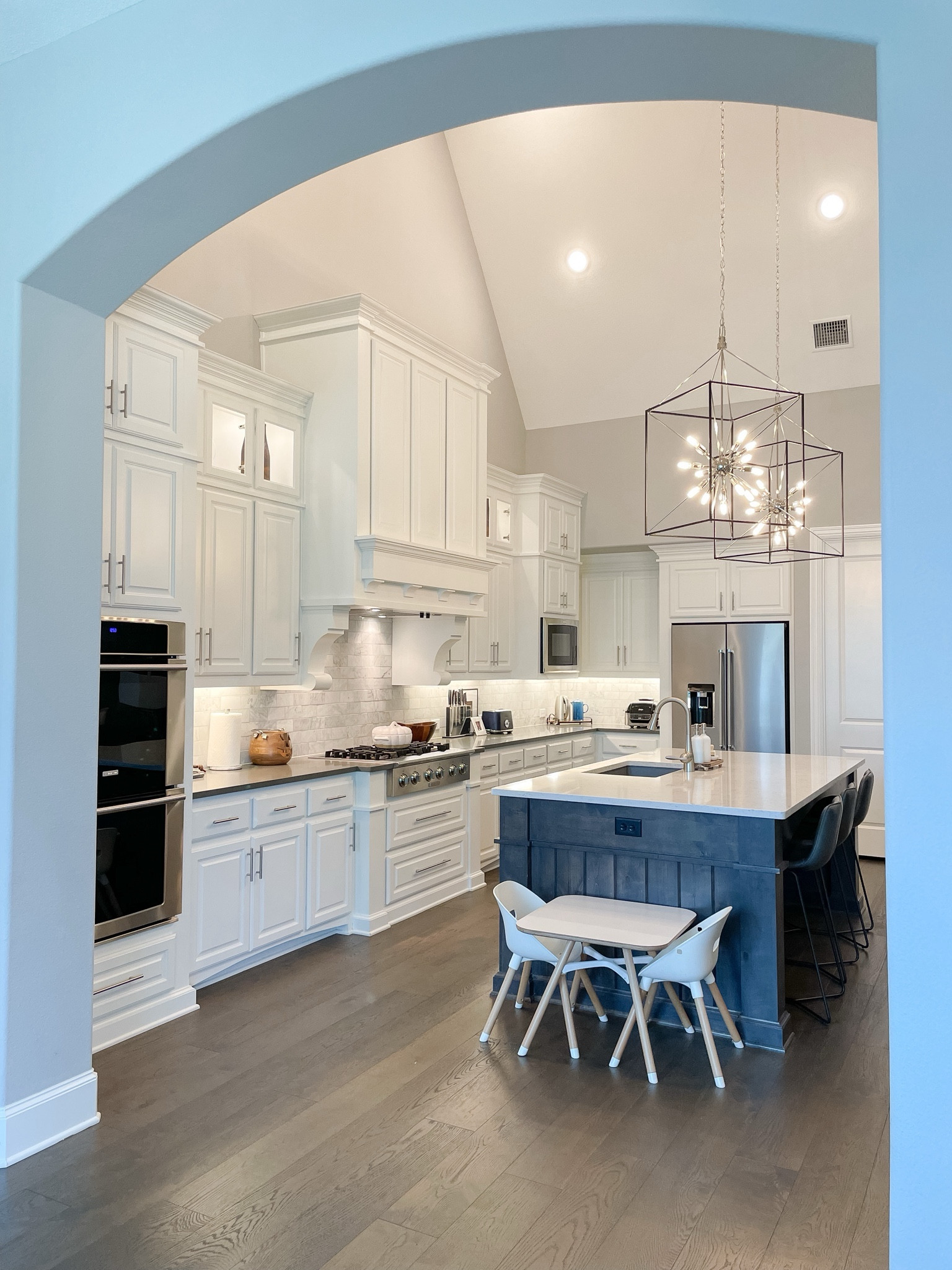 Kids table set up in kitchen. Toddler table in kitchen. 

Lalo play table, transitional kitchen, two tones kitchen, quartz counters, statement lighting 

#LTKhome #LTKkids