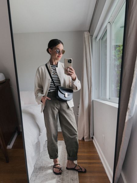 Daily Look 5.22

Kule tee, XS, fits TTS. H&M bomber jacket, sold out in this color, similar linked. Everlane pants, 0, fits TTS. Dolce Vita sandals, 6.5, fit TTS. Sèzane bag. Quince sunglasses  

#LTKOver40 #LTKSeasonal