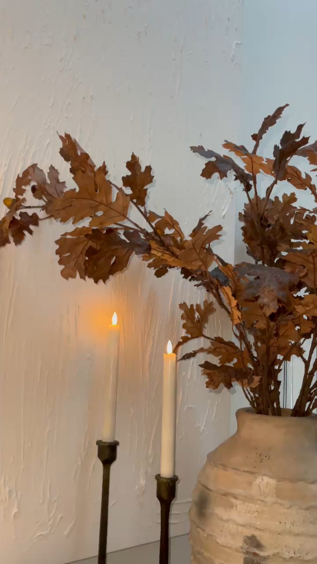 These Faux Fall Stems are everything! Amazing quality and so realistic.  I added 4 stems to this vase for this look. (Vase is on clearance!)

The way these battery operated candles flicker off the leaves makes for such a cozy, moody, vibe. I have these candles all over ✨



#LTKSeasonal #LTKHome #LTKSaleAlert