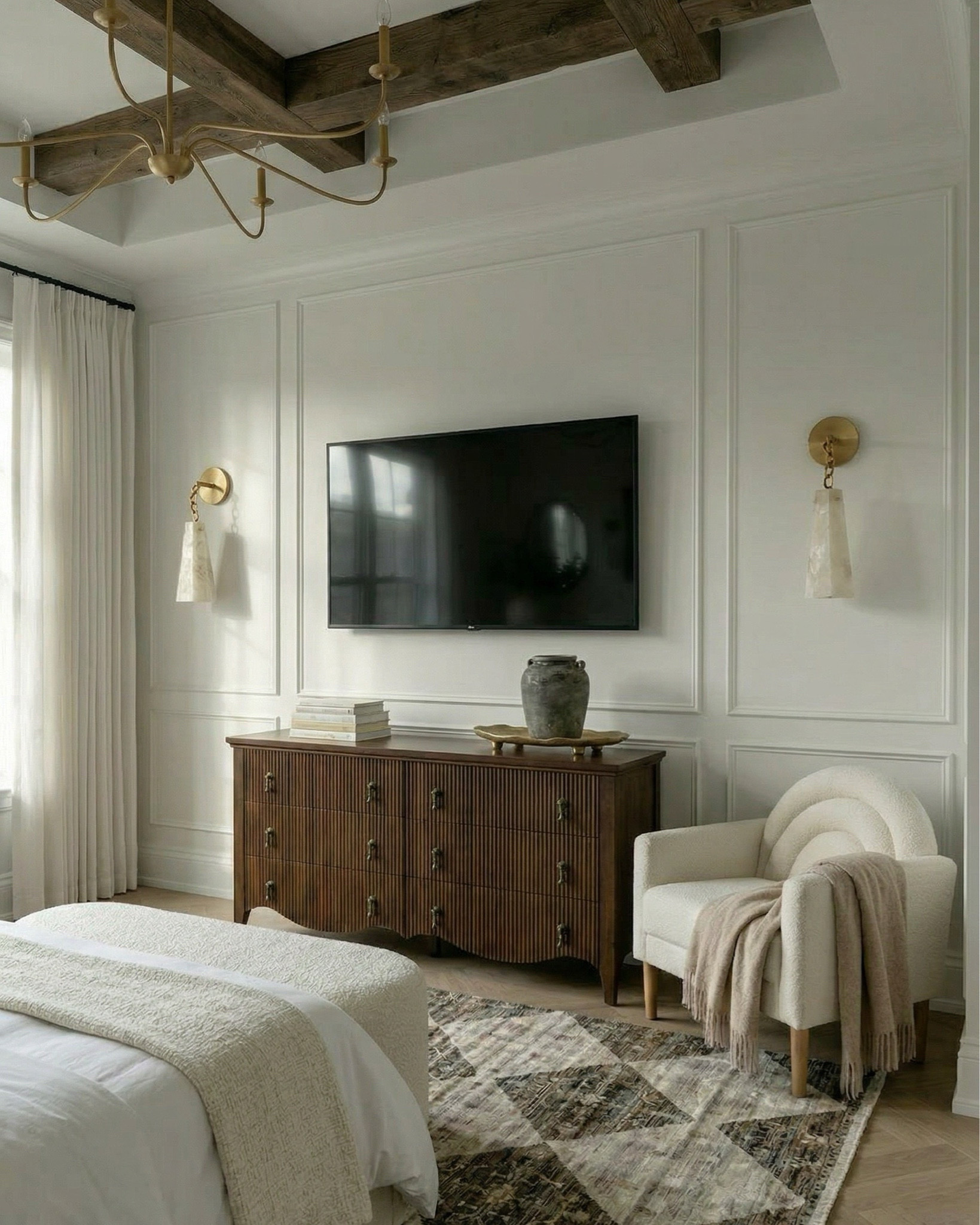 Shop the look:
* Upholstered bed cream textured fabric
* Channel tufted bed neutral
* Boucle bench ivory curved modern
* Ribbed wood nightstands dark walnut
* Curved wood dresser fluted front
* Modern vintage dresser brass hardware
* Boucle accent chair cream wood legs
* Brass chandelier modern candle style
* Gold minimalist chandelier linear arms
* Brass wall sconces stone shade
* Alabaster wall sconces gold
* Ceramic table lamp cream base white shade
* Moody floral wall art large canvas
* Gold scalloped wall mirrors
* Decorative ceramic vase large neutral
* Greenery stems in ceramic vase
* Black and brown patterned throw pillow
* Stacked neutral coffee table books
* Decorative stone bowl tray
* White duvet cover luxury hotel style
* Chunky knit throw blanket brown
* Neutral throw blanket layered bedding
* White pillows minimal bedding
* Textured cream bed upholstery
* Brown cream geometric area rug
* Diamond pattern rug neutral tones
* Vintage inspired rug brown beige
* Neutral bedroom ideas
* Beige and brown bedroom decor
* Luxury neutral bedroom
* Organic modern home decor
* Cozy minimalist bedroom
* Designer inspired bedroom
* Timeless bedroom design

#LTKhome #LTKsale #LTKstyletip