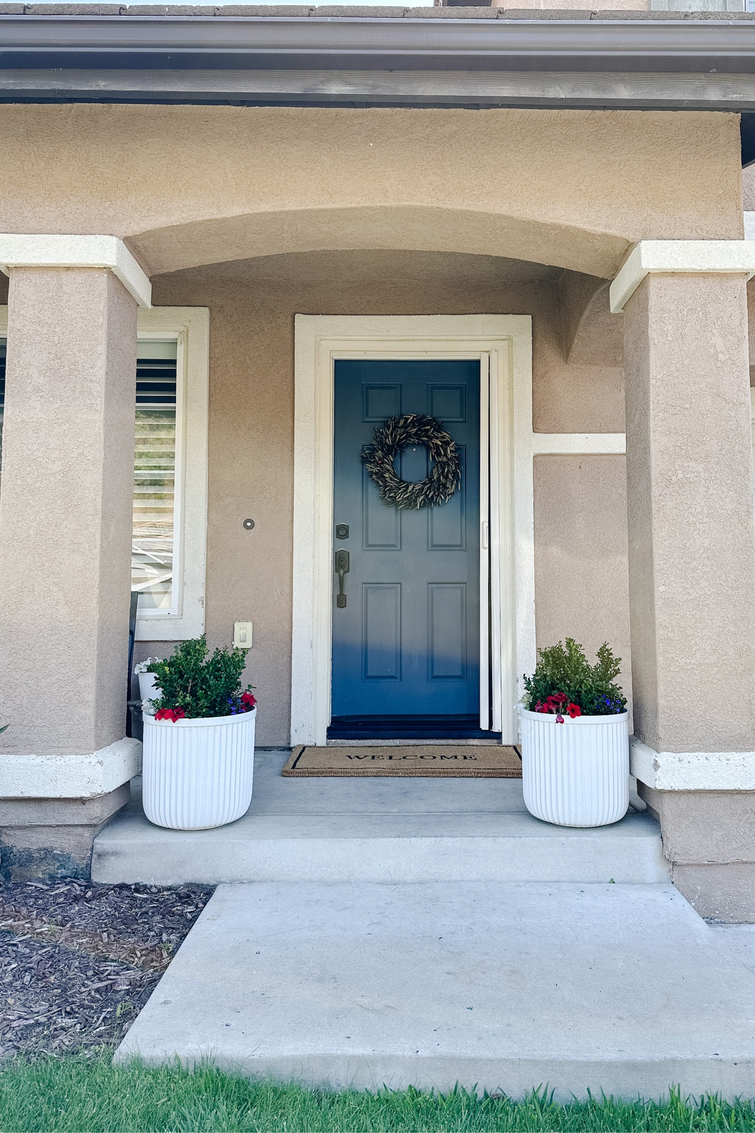 Front porch decor, front porch refresh for 4th of July, large white indoor/outdoor planters, large welcome doormat.

#LTKhome #LTKSeasonal