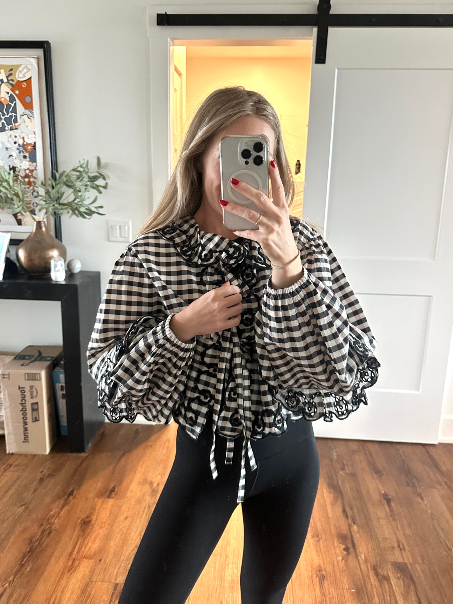 How FUN is this gingham top?! I love how extra the sleeves are!  I have wanted this for so long and finally snagged it now that it’s on sale. I can’t wait to style this as a Thanksgiving outfit (but also for a cute date night outfit). It is one size fits all - the ties make it adjustable :) 

#LTKSaleAlert #LTKSeasonal #LTKHoliday