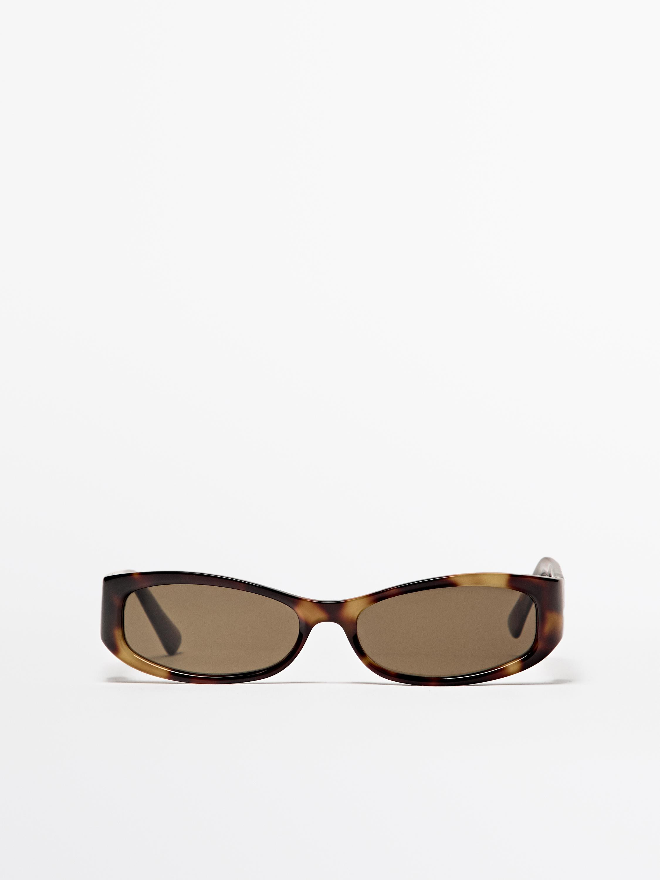 Monture épaisse effet écaille. Verres avec filtre de protection UV III. Comprend un étui de pr... | Massimo Dutti FR