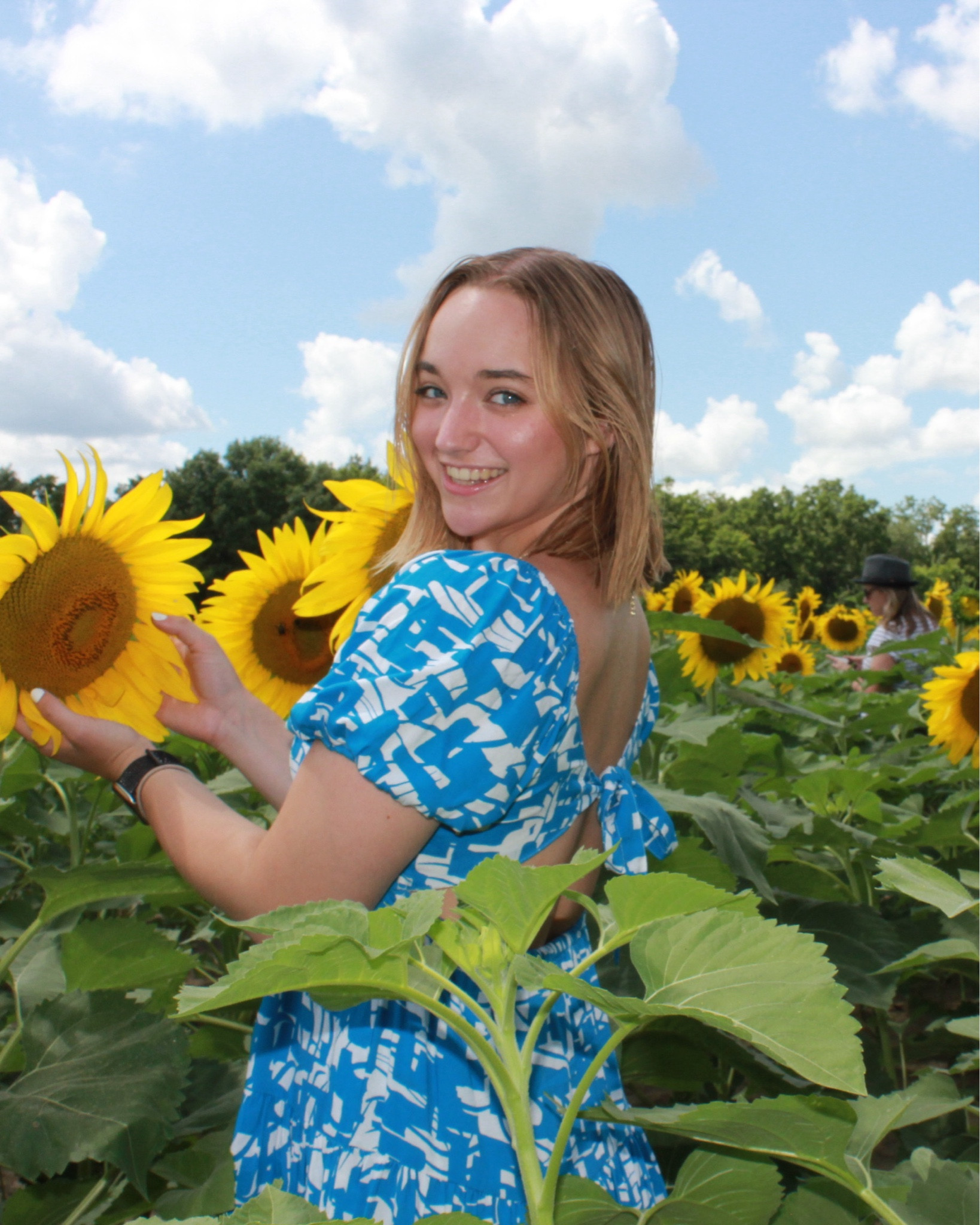 The cutest blue and white patterned tie back dress with puff sleeves paired with my Ariat boots (not shown) for the sunflower field, would be perfect for graduation photos, family photos, or potentially engagement photos 

#LTKStyleTip #LTKWedding #LTKSeasonal