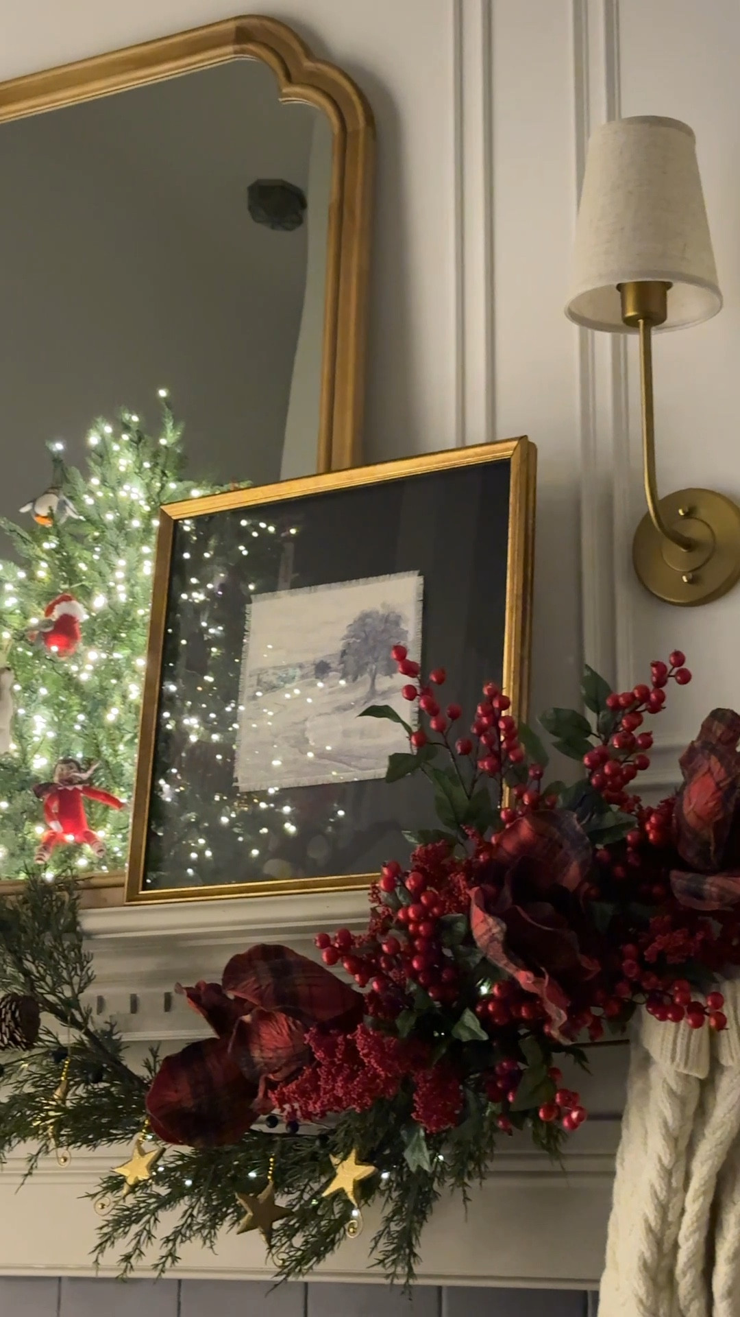 A twinkling classic Christmas. 

Christmas decor
Christmas garland
Twinkle lights
Sconce
Mirror
Framed art
Hurricane candle
Fake Christmas tree  
Dog book ends


#LTKHome #LTKSaleAlert #LTKHoliday